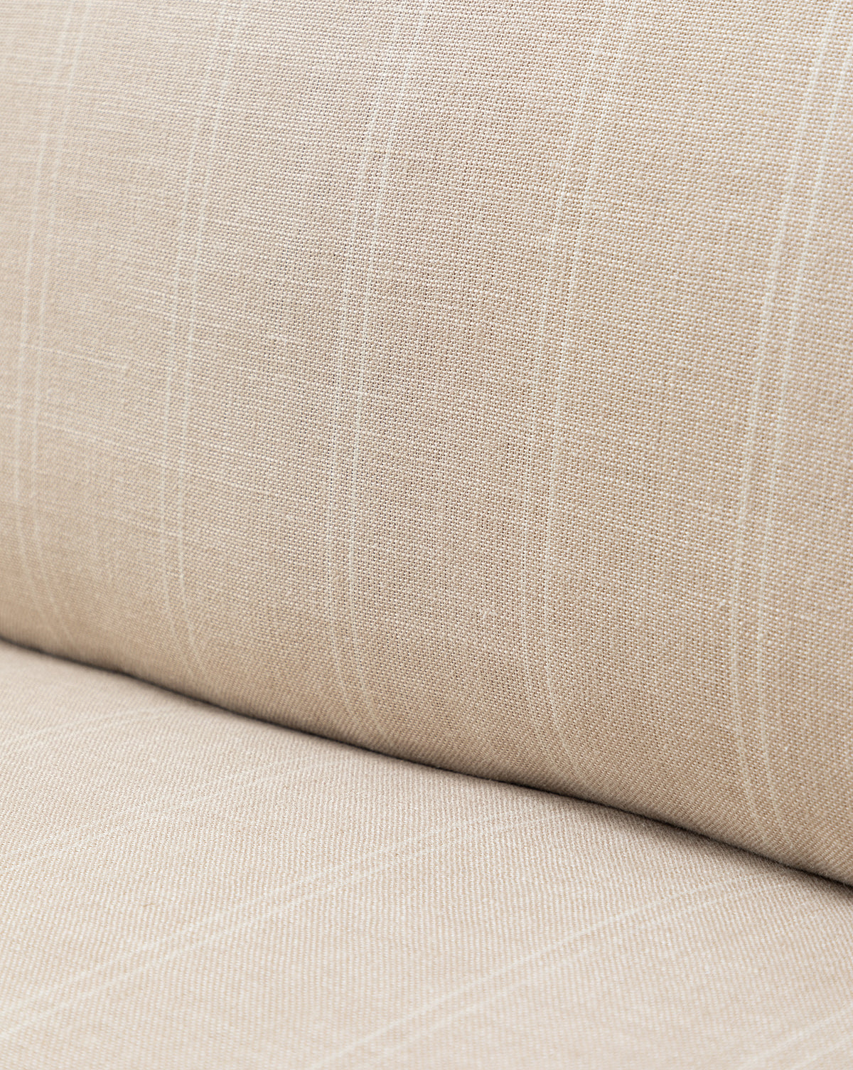 Close-up of beige fabric on the Philippa Settee (Ready to Ship), featuring a cushioned seat and backrest with a subtle plaid pattern and slim, light lines for a contemporary look, by McGee & Co.