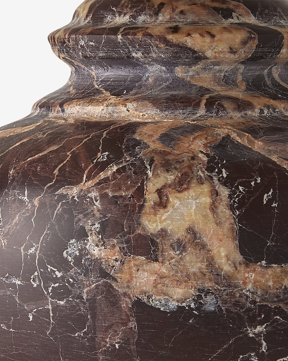 Close-up of polished dark brown marble with tan and beige veining, ideal for accentuating the natural patterns and texture when paired with the Piccolo Table Lamps elegant alabaster base, by McGee & Co.