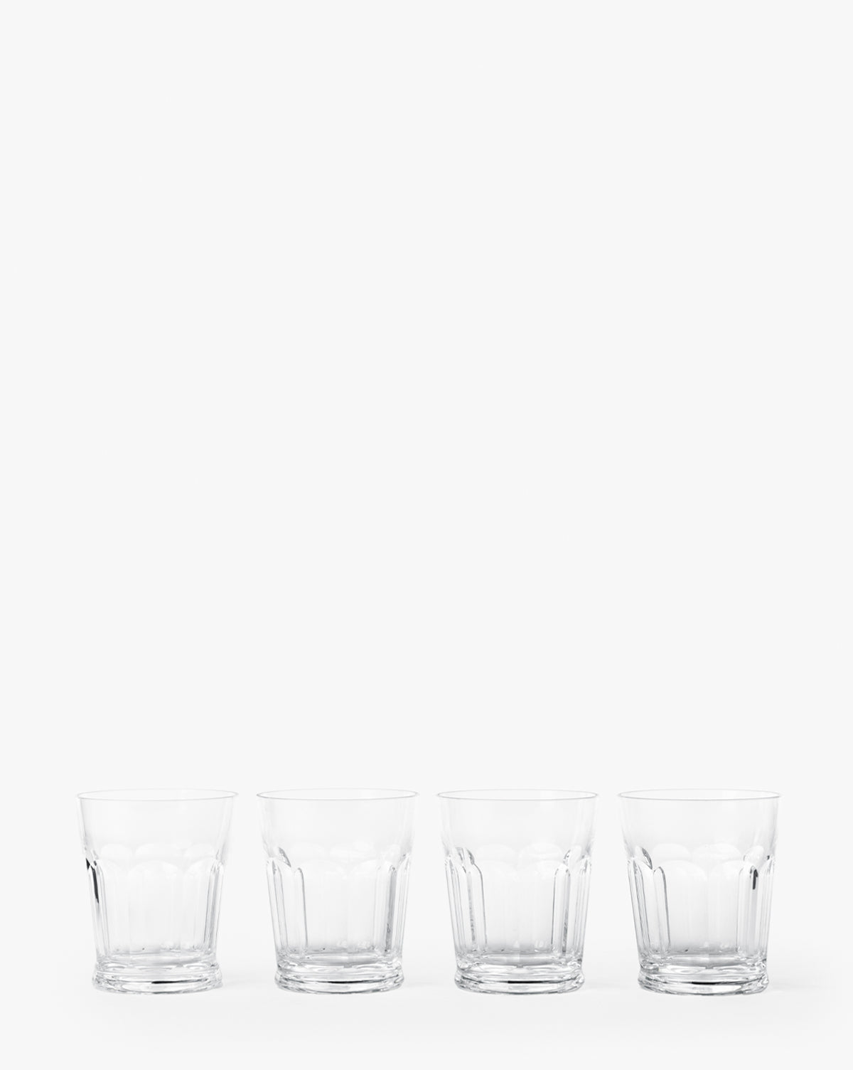 The Pickwick Acrylic Tumblers (Set of 4) are shown empty and side by side on a plain white background—ideal for adding style to your outdoor table settings, by McGee & Co.