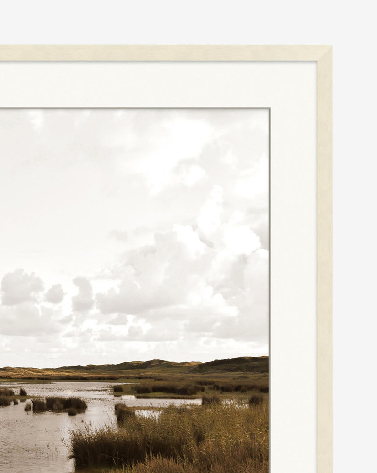 The Pond & Meadow photograph features a marsh landscape with tall grasses, water, and distant hills beneath a cloudy sky. Its simple light natural glass frame makes it ideal wall art.