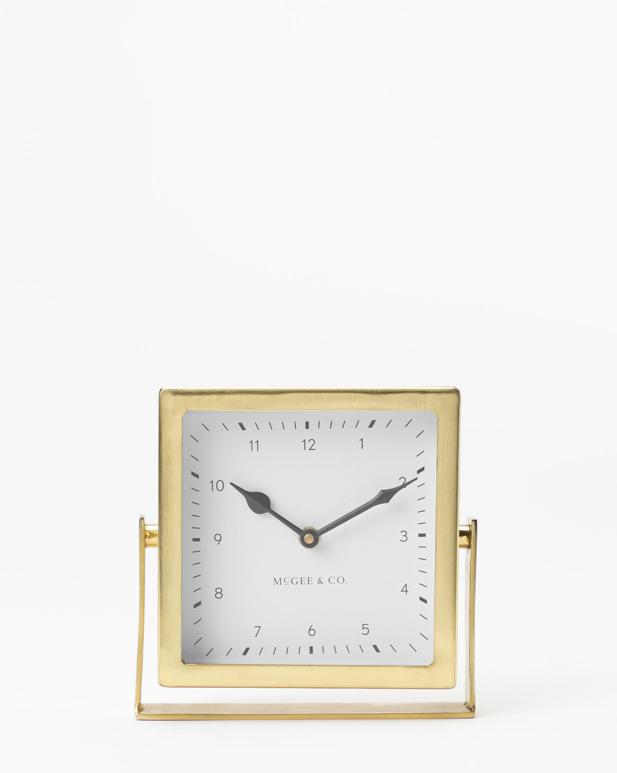 The Posey Table Clock is a square gold nightstand clock with black hour and minute hands, a white face with black numerals, and MCGEE & CO. printed near the bottom—an elegant, timeless addition to any table or desk.