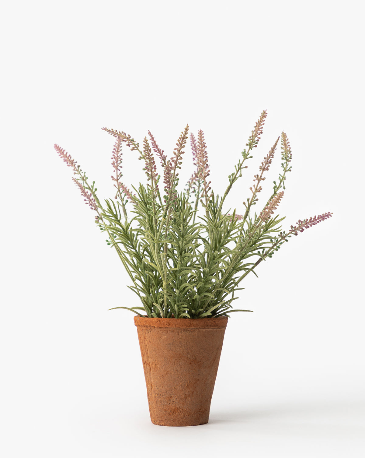 A Potted Faux Lavender Topiary, with slender green leaves and light purple flower spikes, sits in a small terracotta pot against a plain white background.