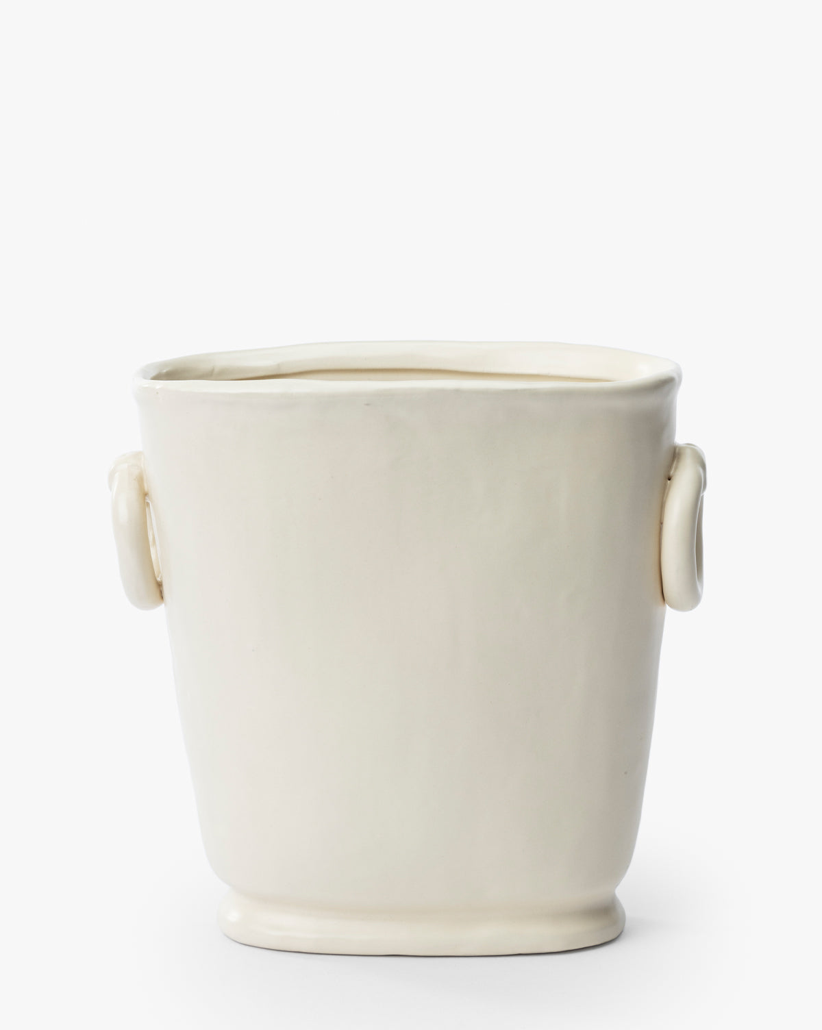 The Powell Ceramic Vase features a cream-colored ceramic body, smooth finish, subtle rounded handles, and a slightly flared rim—perfect as a decorative accent for any space.
