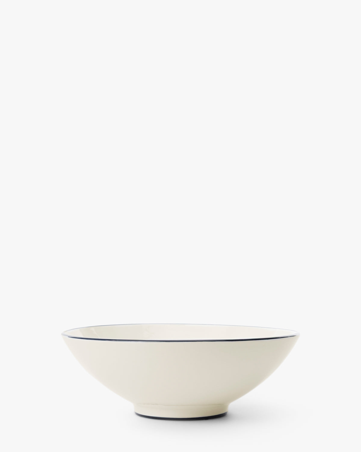 The Pritchard Serving Bowl is a shallow, cream-colored ceramic piece with a slim dark rim, displayed on a plain white background, by McGee & Co.