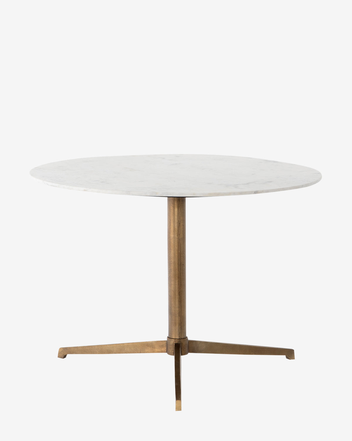 The Priya Dining Table features a round white marble top and a single brass pedestal base with three legs, displayed against a plain white background by McGee & Co.