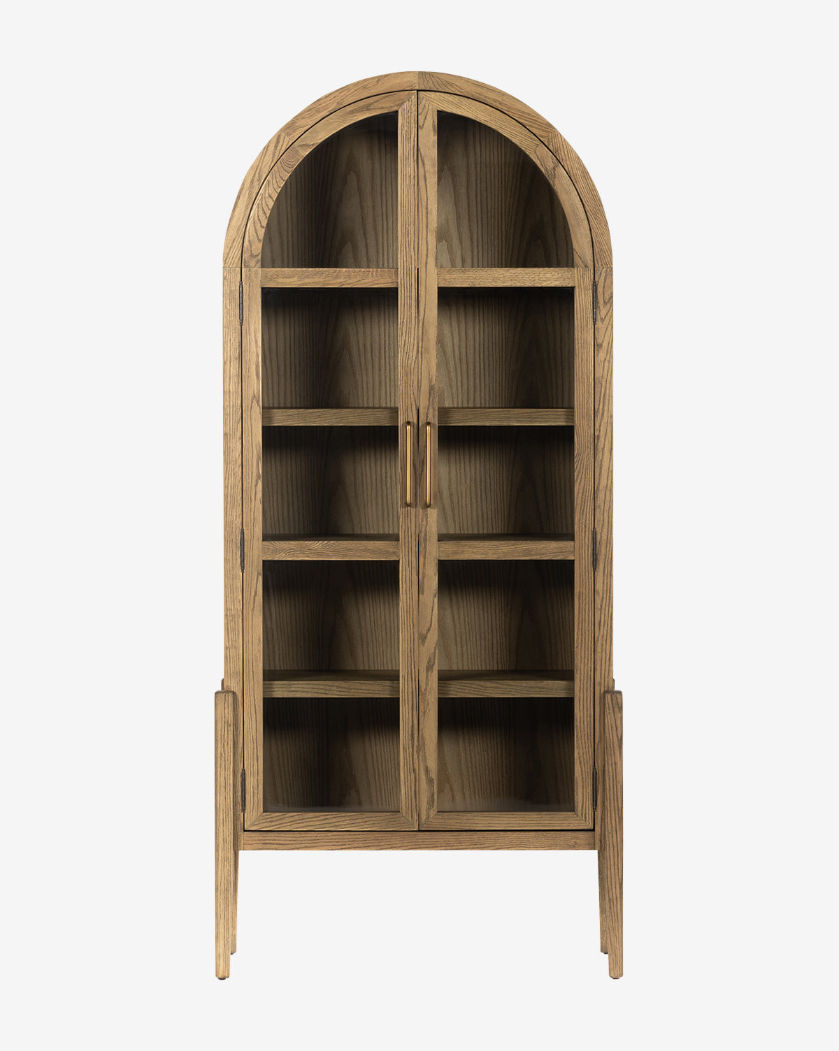 The Providence Cabinet is a tall, solid oak cabinet with an arched top, glass double doors, five interior shelves, two vertical handles, and four legs, shown against a white background by McGee & Co.