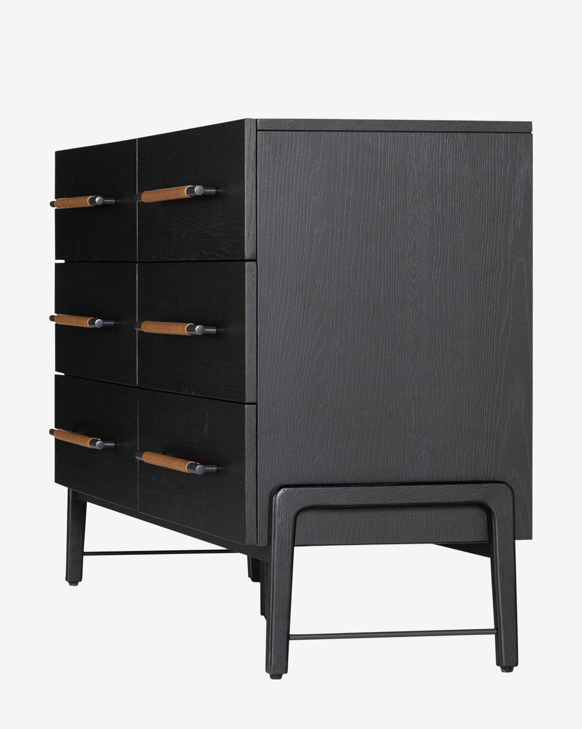 The Ralston 6-Drawer Dresser is a black oak dresser with six drawers featuring leather pulls, elevated on four legs connected by horizontal bars for style and stability.