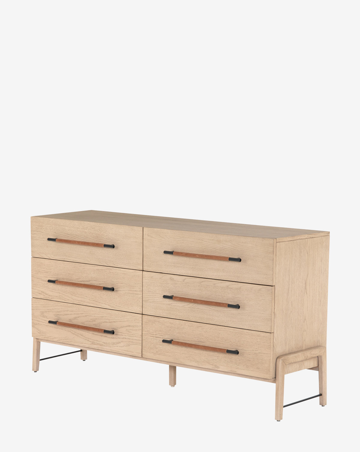 The Ralston 6-Drawer Dresser features a light oak finish, black metal legs, and long black and brown leather drawer pulls, photographed against a plain white background.