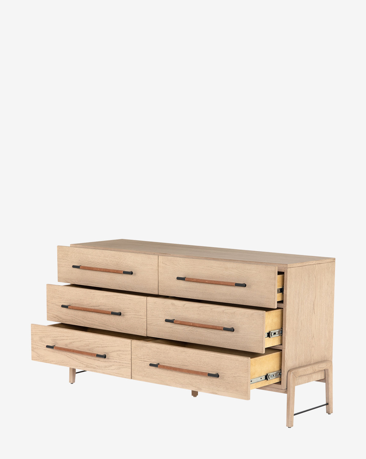 The Ralston 6-Drawer Dresser features six drawers with long horizontal handles, a light oak finish, and stands on short legs for a modern look. Three drawers are partially open, revealing the interior.