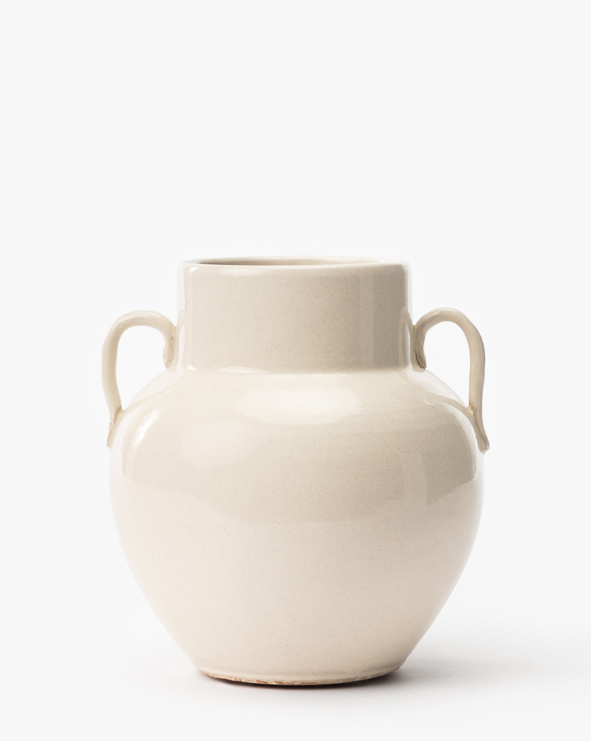 The Rasley Handled Jar, a cream-colored porcelain piece with two small side handles, a rounded body, and a short wide neck, is shown against a plain white background, by McGee & Co.