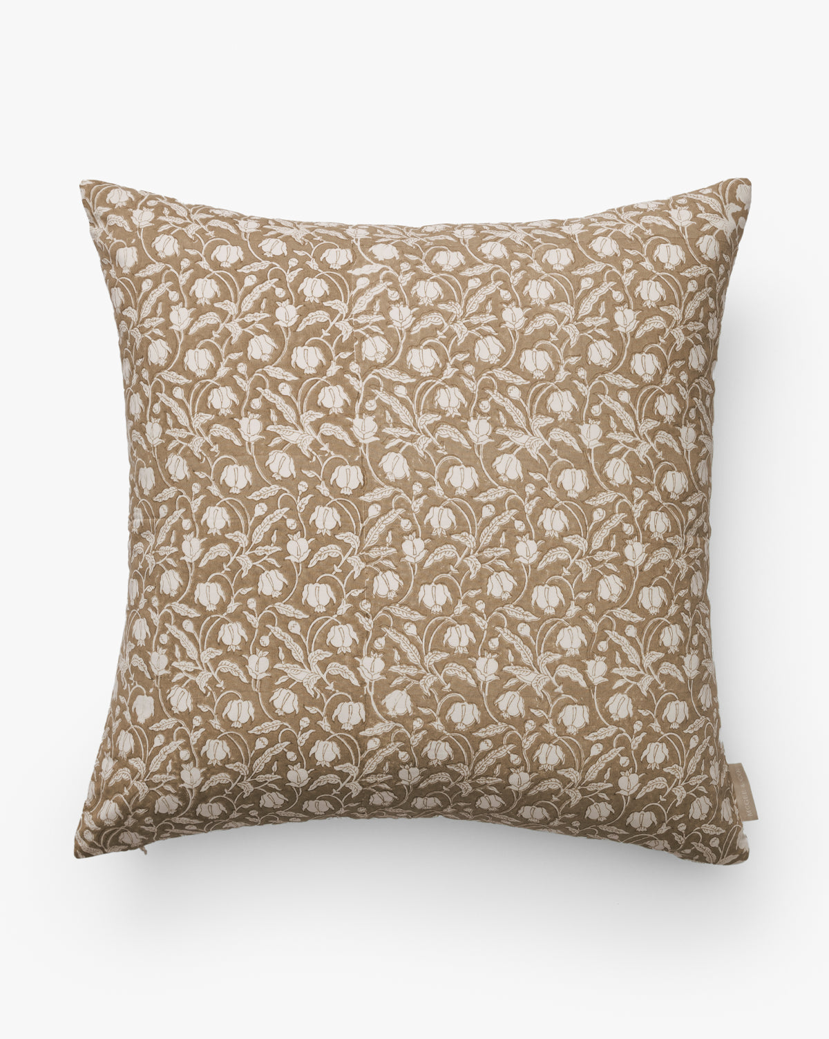 The Ravenna Block Print Pillow Cover features a light brown background with an all-over white, stylized floral pattern, shown here set against a plain white background, by McGee & Co.