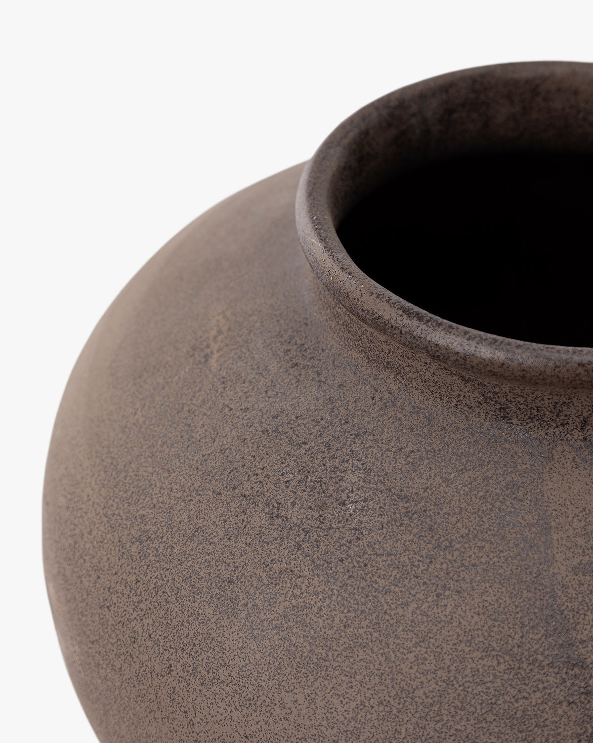 Close-up of the Reading Vase, a round, textured matte brown ceramic piece with a wide opening—ideal for modern home decor, by McGee & Co. Shown against a white background.