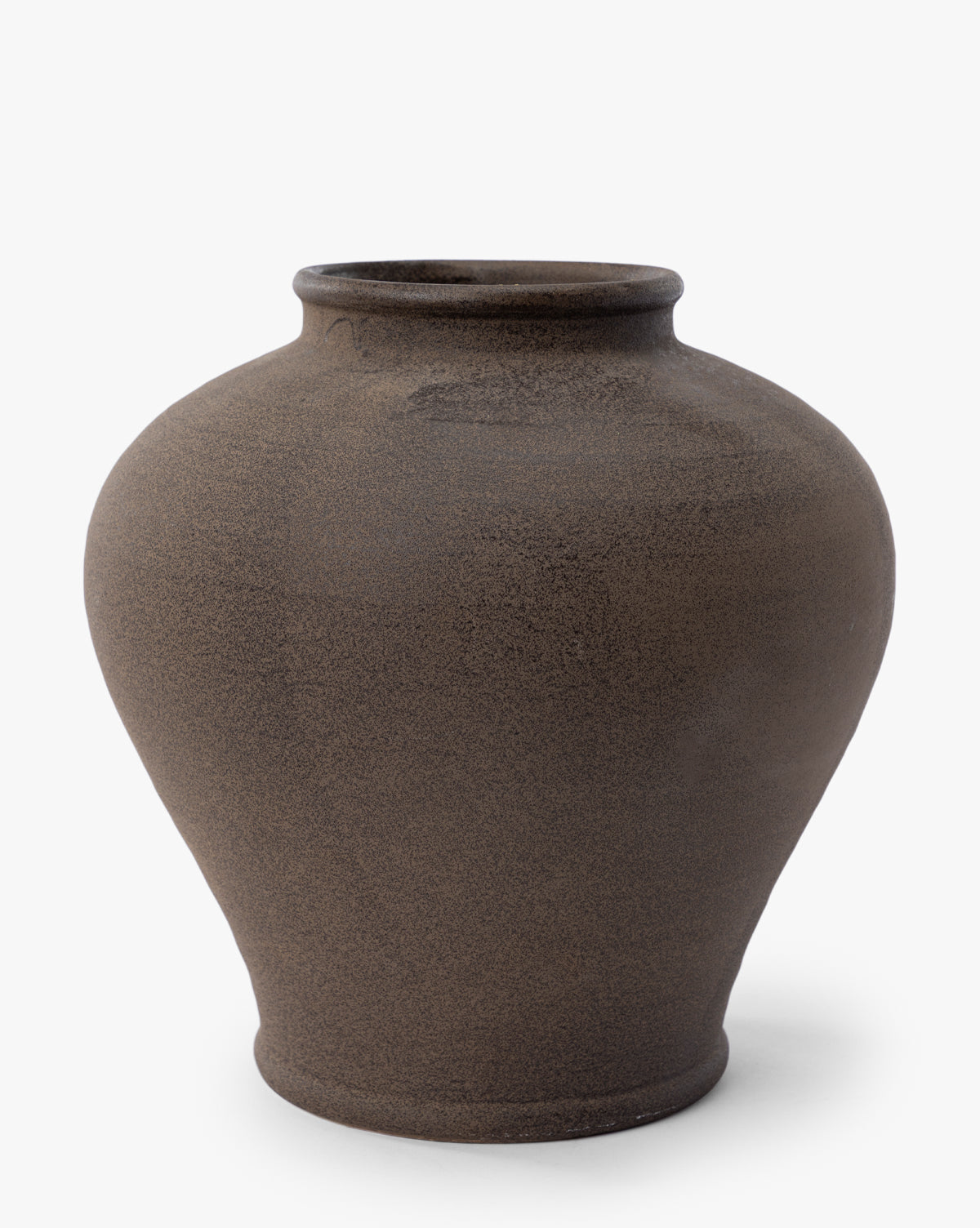 The Reading Vase is a large, round matte brown vase featuring a wide body, narrow base, and slightly flared opening, making it a striking piece of home decor against a plain white background, by McGee & Co.
