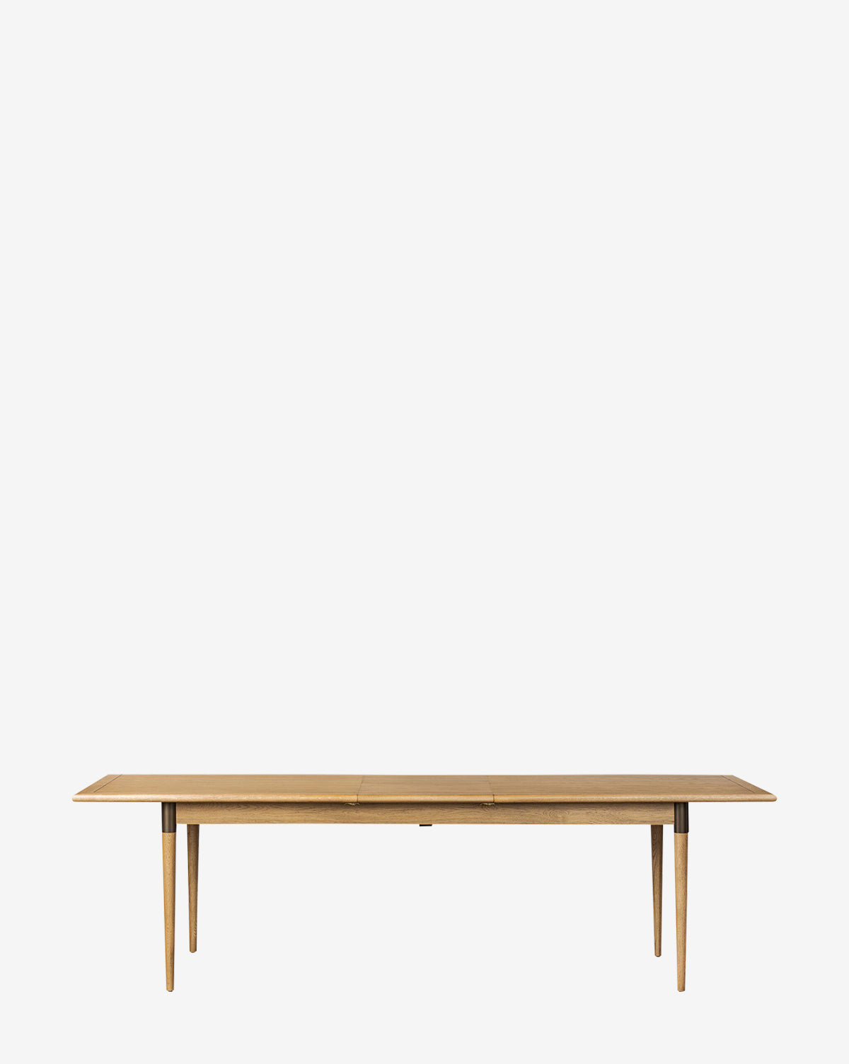 The Redmond Extension Dining Table, featuring a smooth rectangular top and four angled legs with Scandinavian flair, is photographed against a plain white background—ideal for enhancing any dining space by McGee & Co.