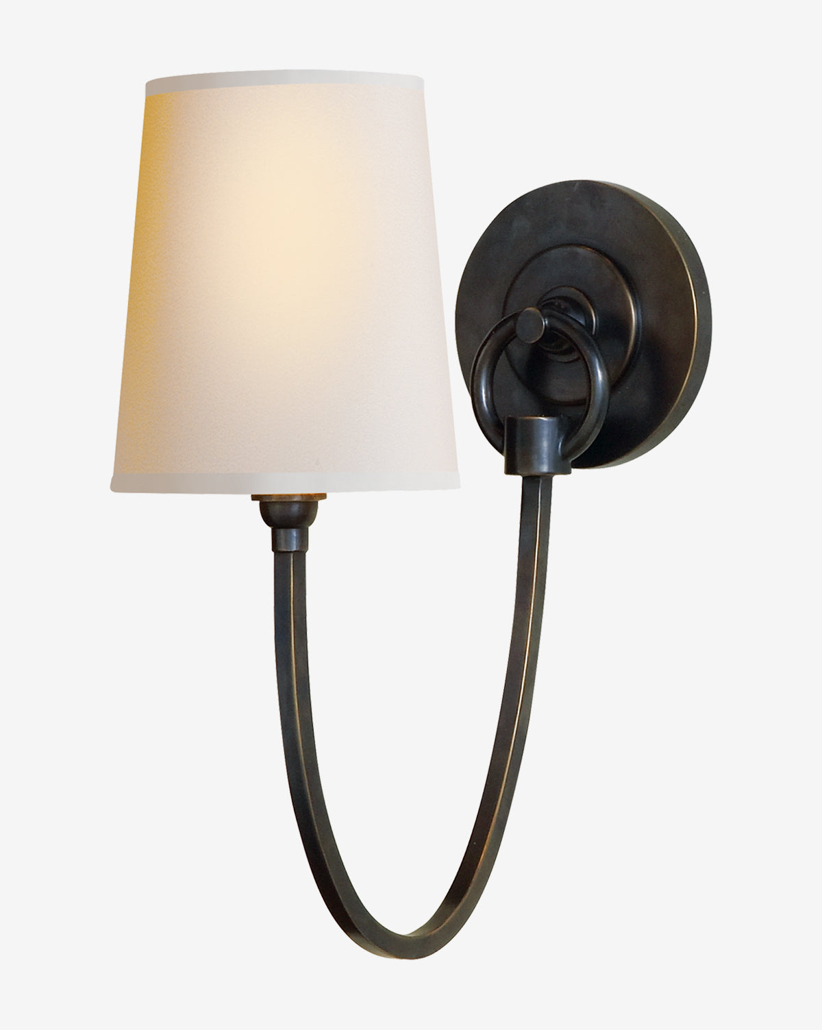 The Reed Single Sconce by Visual Comfort & Co. Signature features a black curved metal arm, round base, and white fabric shade for a modern look that casts a warm, soft glow by McGee & Co.
