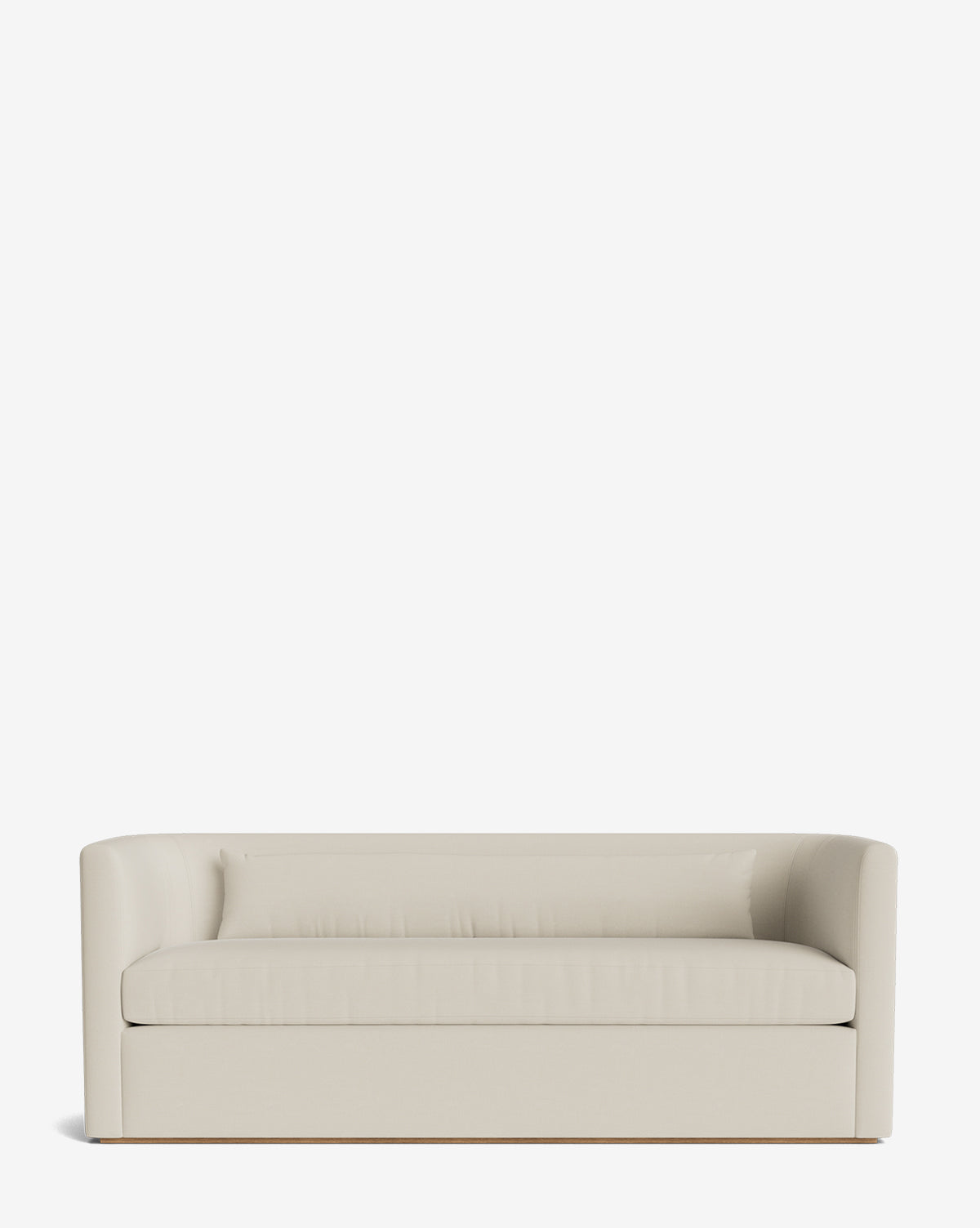 The Reese Sofa (84-96) is a modern, light beige piece with a low backrest, curved armrests, down-wrapped cushions, and handcrafted alder wood legs. Its minimalist contemporary design is shown from the front against a white background, by McGee & Co.