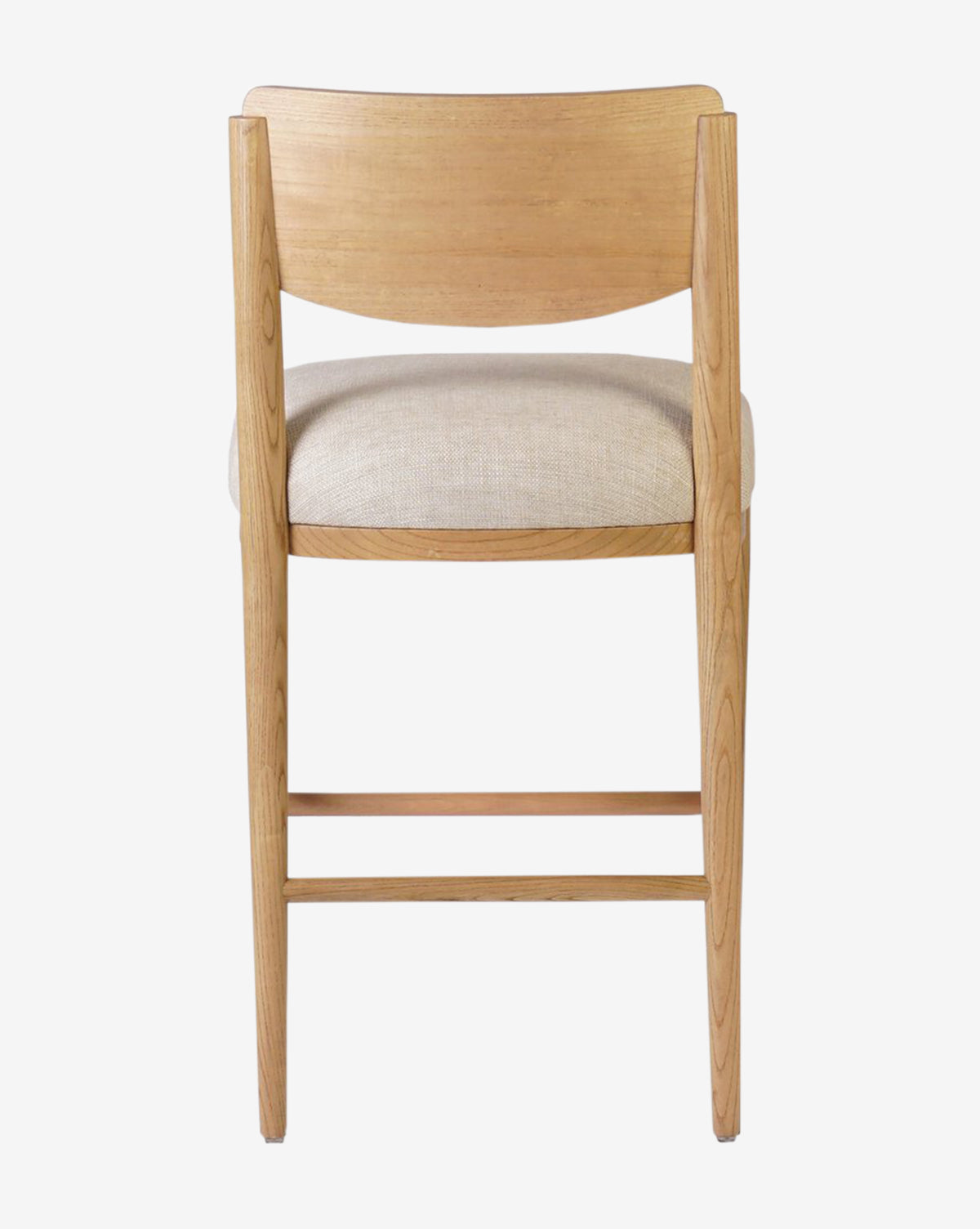 The Reverie Stool by Four Hands is a natural wood bar stool featuring a curved backrest and light beige upholstered seat, shown from behind against a plain white background—an ideal stylish addition to any kitchen. McGee & Co.