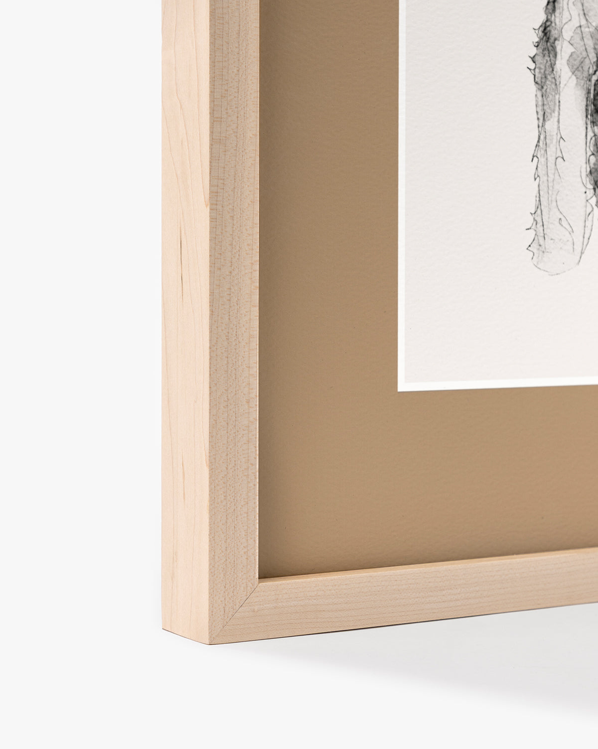 Close-up of the Rex maple frame with a beige mat, featuring part of a black-and-white schnauzer watercolor on white paper. Only one corner of this charming nursery wall art is shown, by McGee & Co.