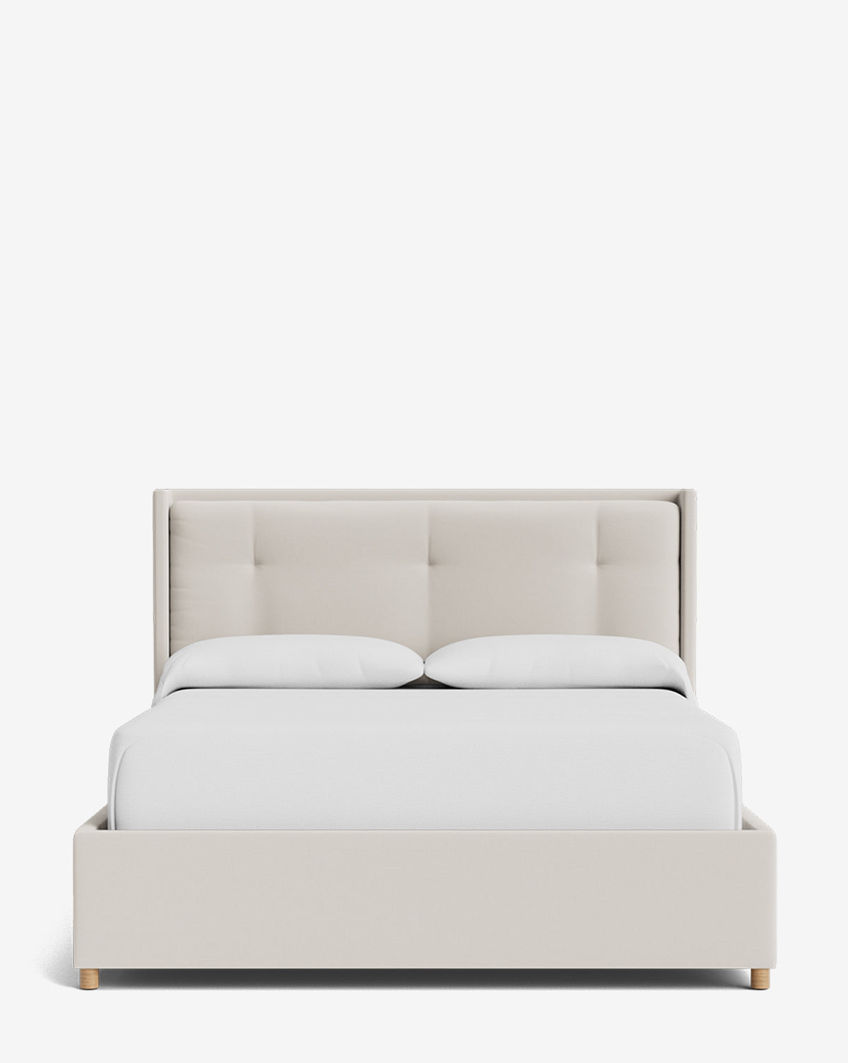 The Ria Bed Low Headboard is shown from the front, upholstered in light beige with a sleek frame and headboard, featuring two white pillows and white bedding against a plain white background by McGee & Co.