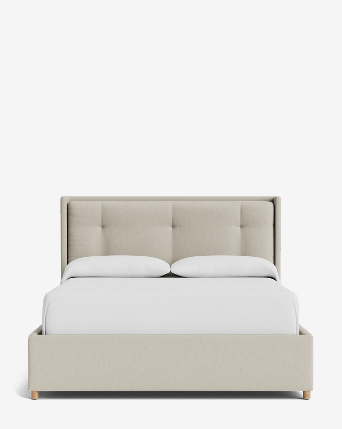 The Ria Bed Low Headboard is a modern beige upholstered bed with a tufted headboard and light wood legs, neatly styled with white bedding and set against a plain white background, by McGee & Co.