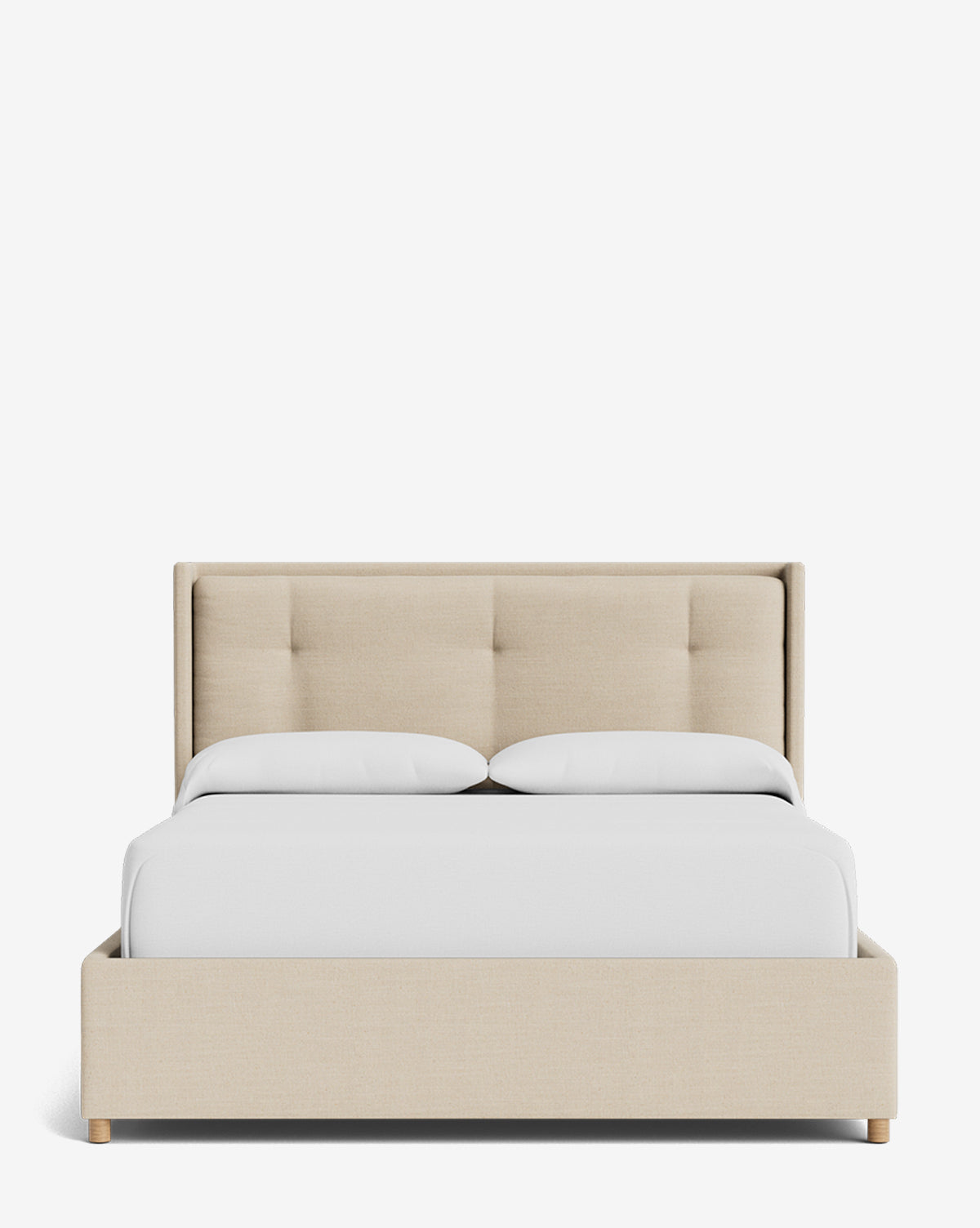 The Ria Bed Low Headboard is displayed from the front, featuring beige upholstery with a tufted headboard, complemented by white pillows and a white comforter, set against a white background, by McGee & Co.