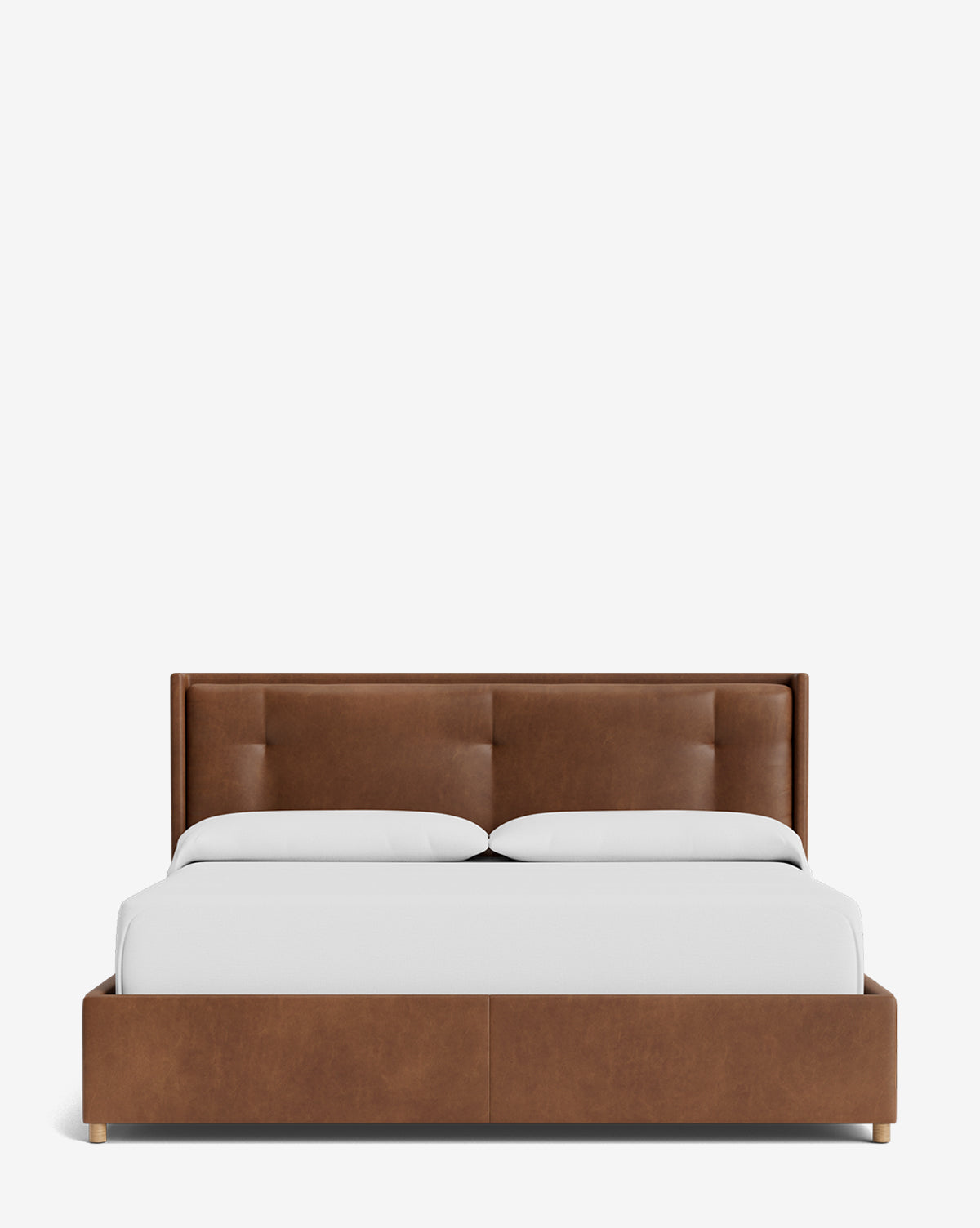 The Ria Bed Low Headboard is a modern bed with a brown leather base, low profile, and plain white bedding, shown from the front against a white background by McGee & Co.