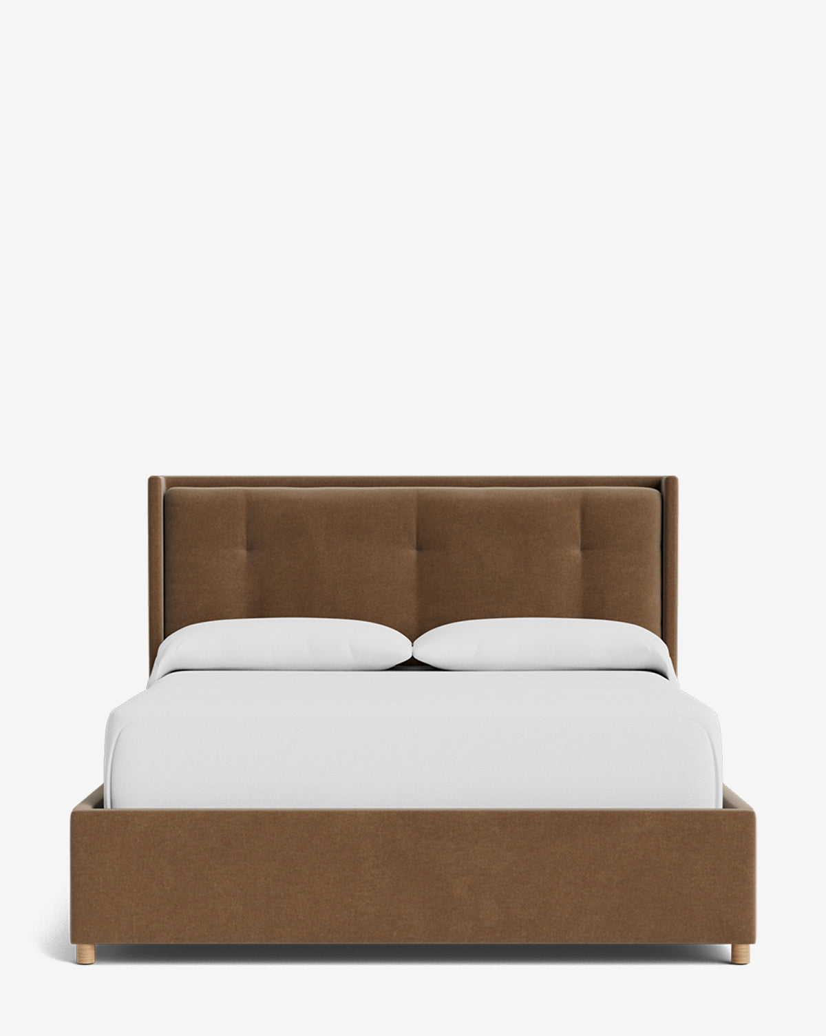 The Ria Bed Low Headboard is a modern brown upholstered bed with a tufted low headboard, white bedding, and two pillows, displayed against a plain white background by McGee & Co.