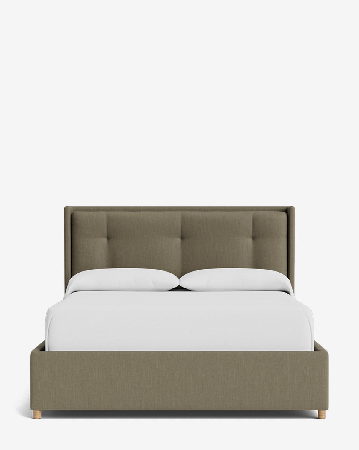 The Ria Bed Low Headboard features a light olive upholstered frame and tufted headboard, styled with crisp white bedding and pillows, set against a plain white background by McGee & Co.
