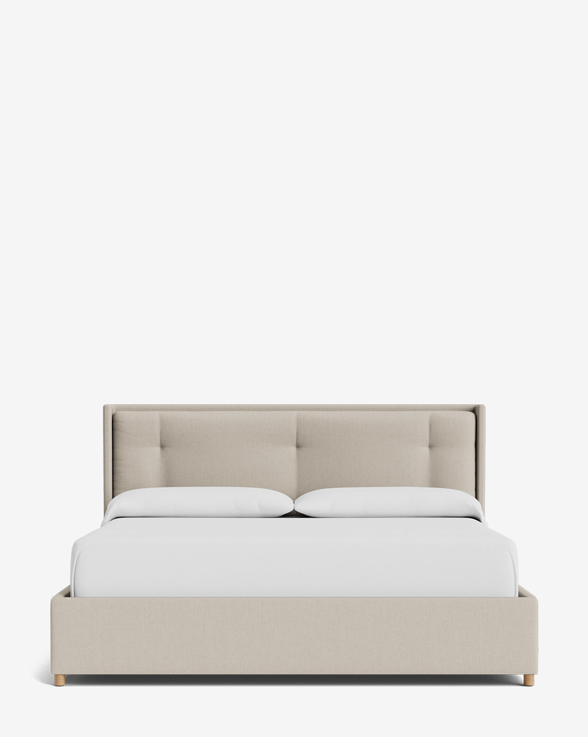 The Ria Bed Low Headboard is a beige upholstered bed with a rectangular, padded headboard, styled with a white duvet and pillows, set against a plain white background by McGee & Co.