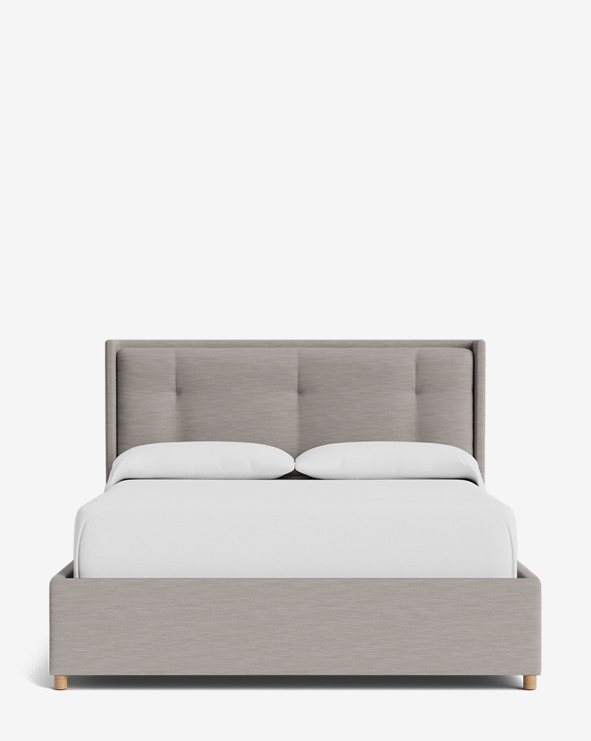 The Ria Bed Low Headboard features light gray upholstery, a low, tufted headboard, and wooden legs, topped with white bedding and two pillows, all set against a plain white background by McGee & Co.