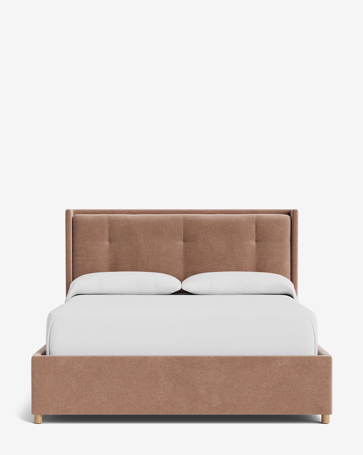 The Ria Bed Low Headboard features a modern light brown upholstered frame with a tufted headboard, paired with two white pillows and a neatly made white comforter, displayed on a plain white background by McGee & Co.