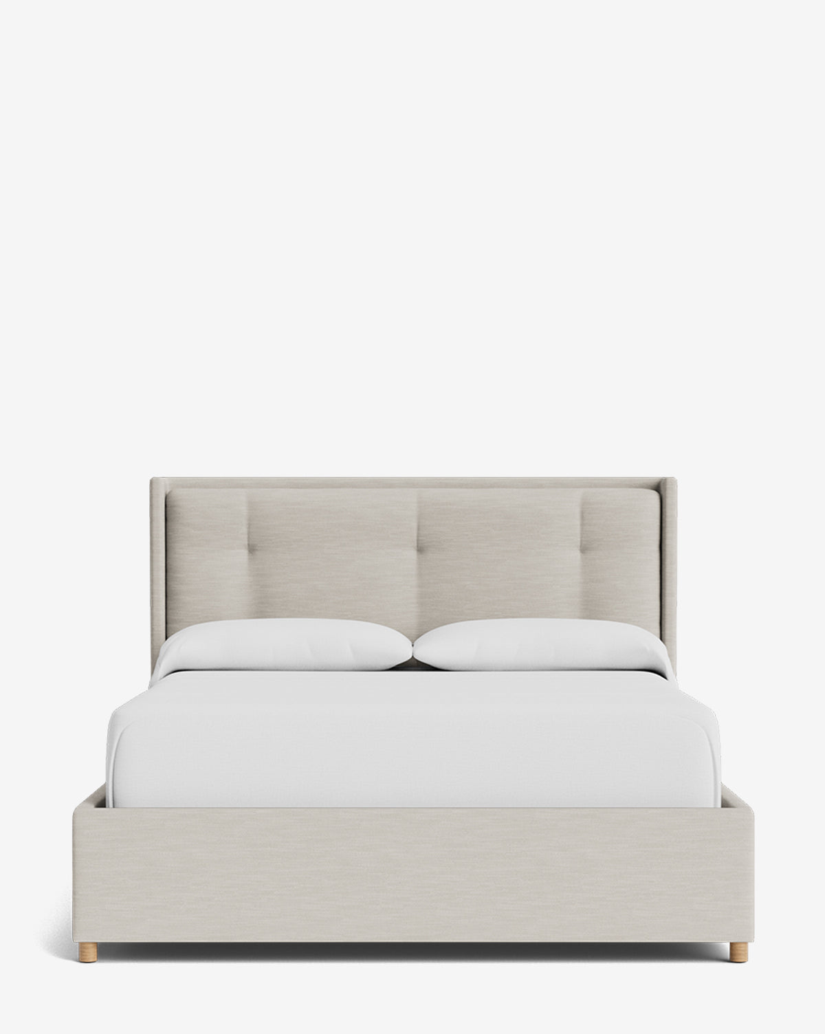 The Ria Bed Low Headboard features modern beige upholstery, wooden legs, and is styled with white bedding and pillows, all set against a plain white background by McGee & Co.
