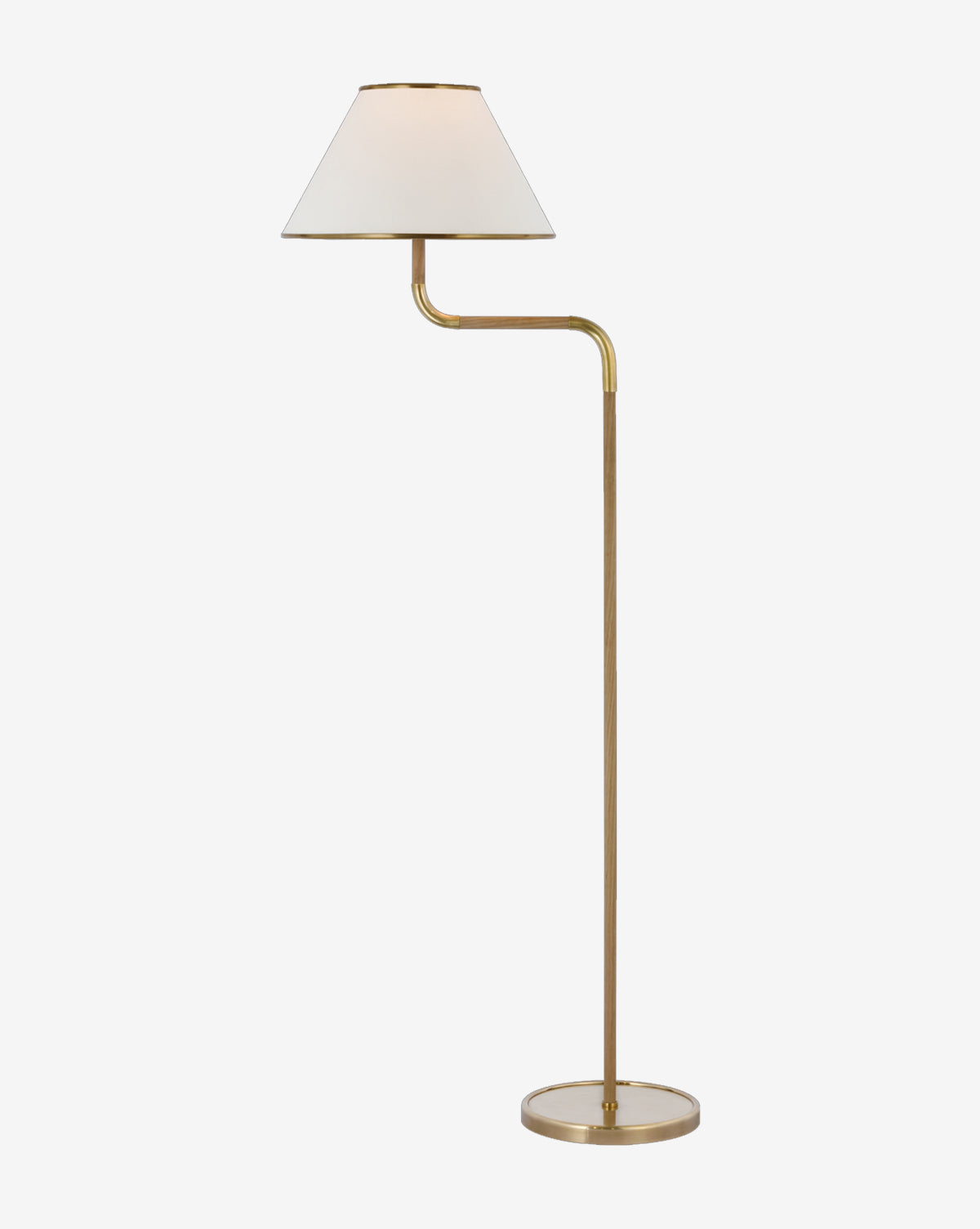 The Rigby Medium Bridge Arm Floor Lamp by Visual Comfort & Co. Signature features a brass finish, round base, slim stand, and angled arm with a white linen shade—its minimalist design pairs perfectly with modern chandeliers. McGee & Co.