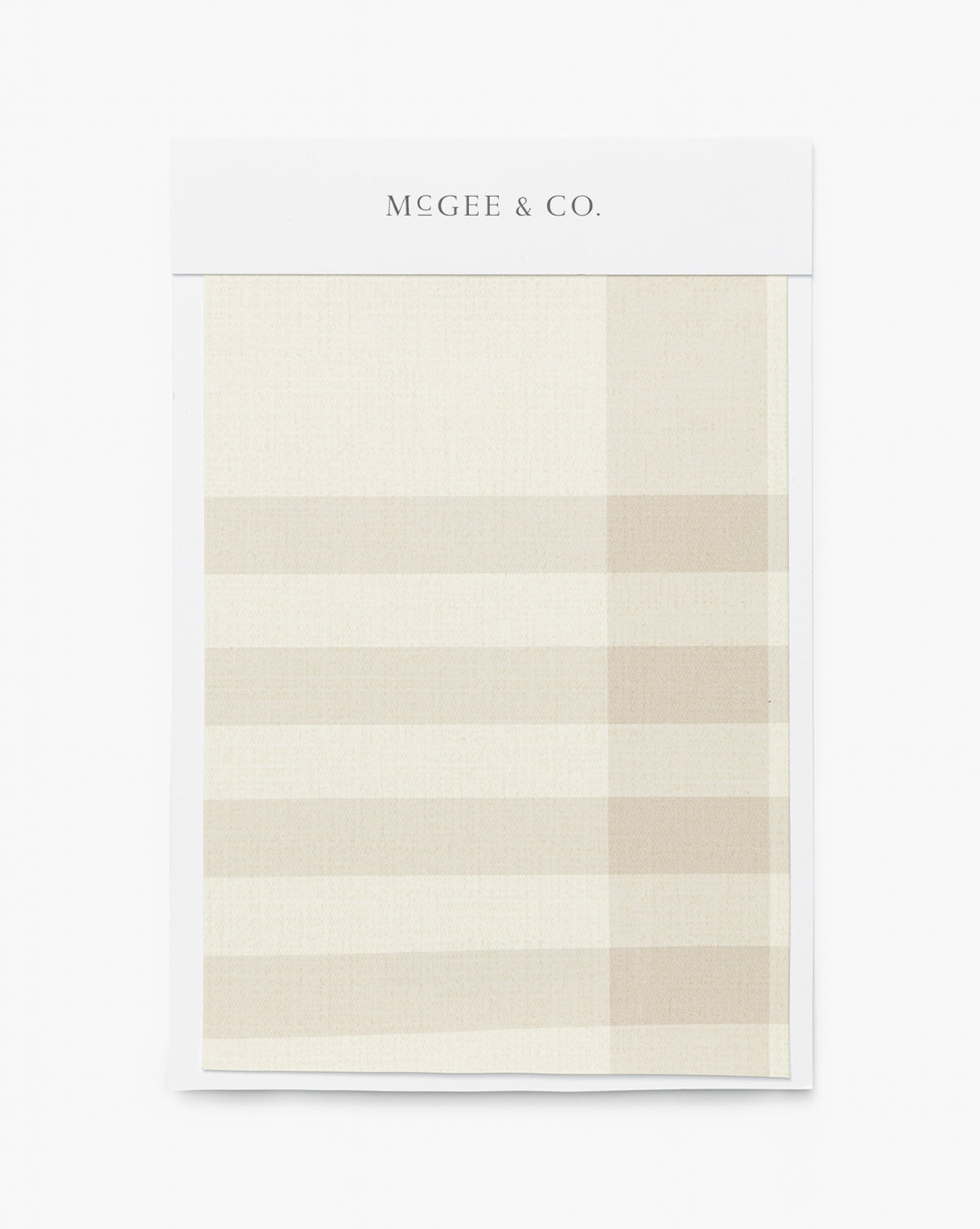 The Rigby Plaid Print Wallpaper Swatch by York Wallcoverings features a large checked pattern in cream and beige—ideal inspiration for designer home decor or plaid print wallpaper ideas by McGee & Co.