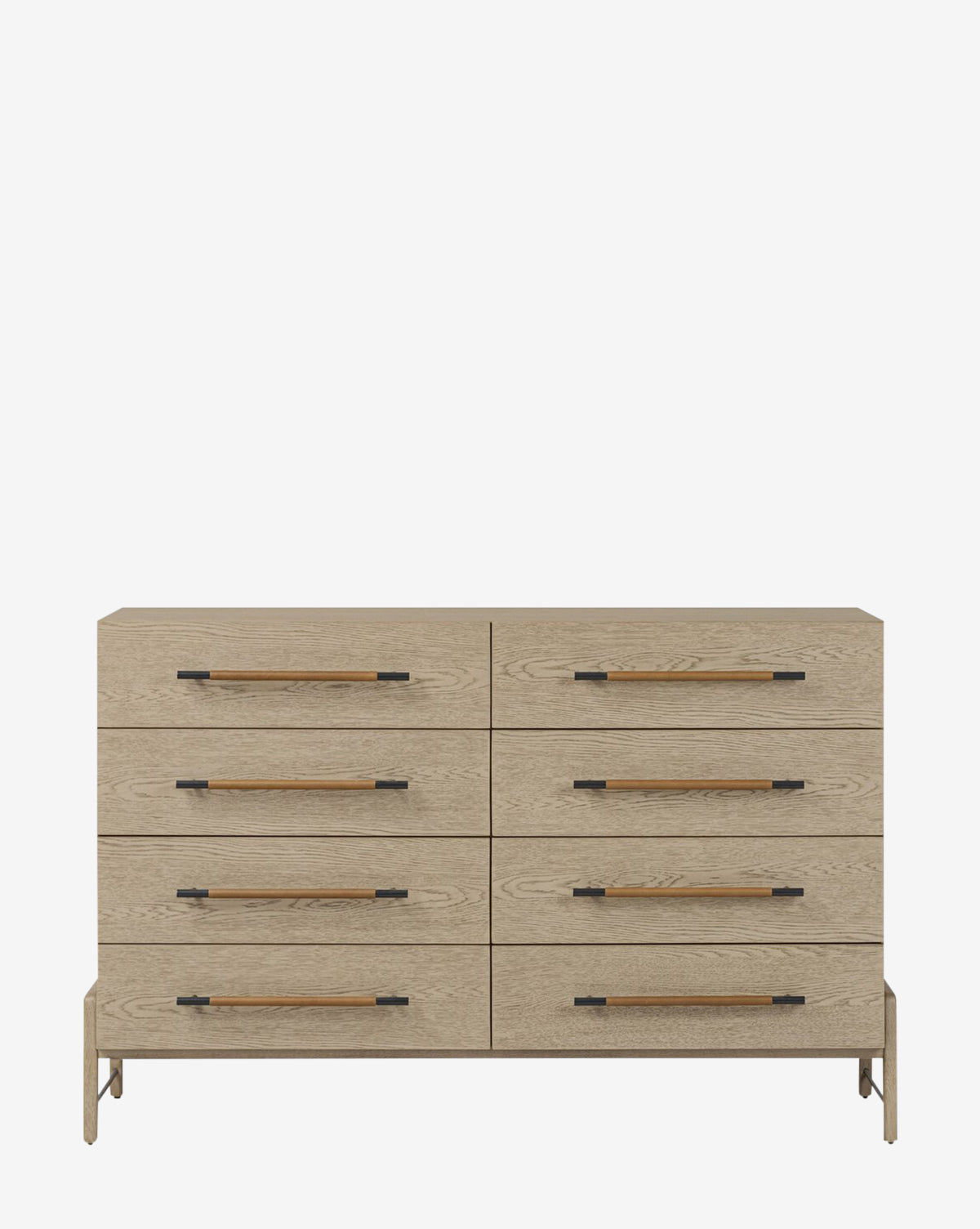 The Rivelle Dresser features a natural light wood finish, eight drawers arranged in two rows, long dark brown handles with black metal accents, and makes a stylish bedroom statement against a white background, by McGee & Co.
