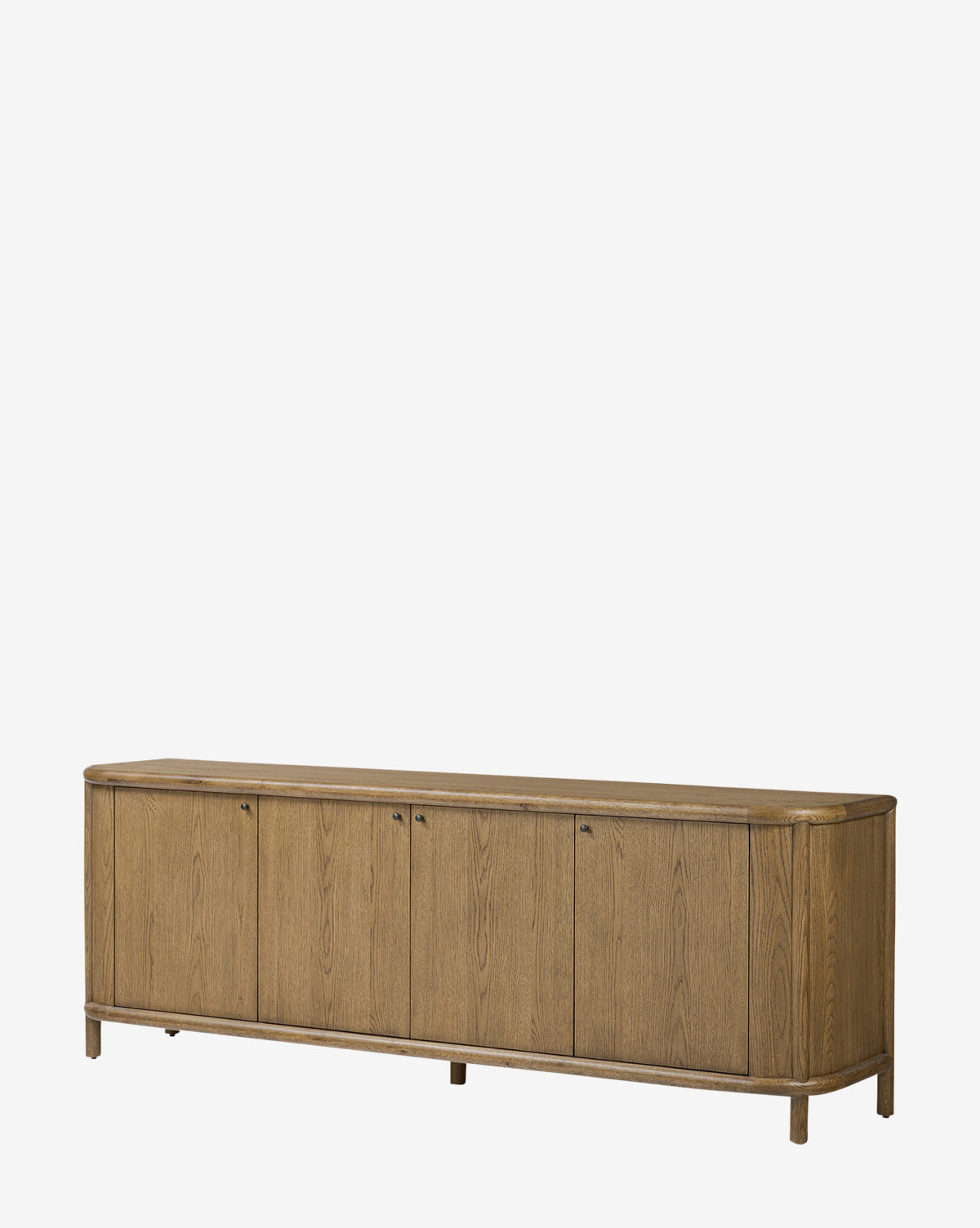 The Rolette Sideboard is a long oak sideboard with six cabinet doors, gunmetal pulls, rounded corners, and short legs, shown against a plain white background by McGee & Co.