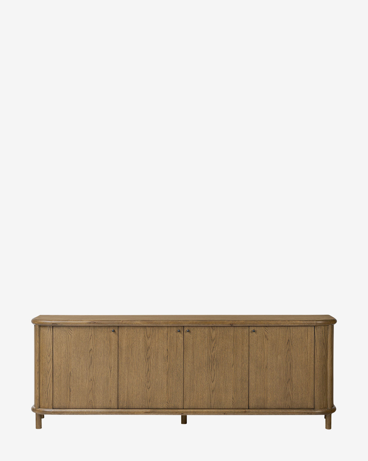 The Rolette Sideboard is a long, rectangular oak piece with four cabinet doors, smooth top, rounded edges, and sleek gunmetal pulls, placed against a plain white background by McGee & Co.
