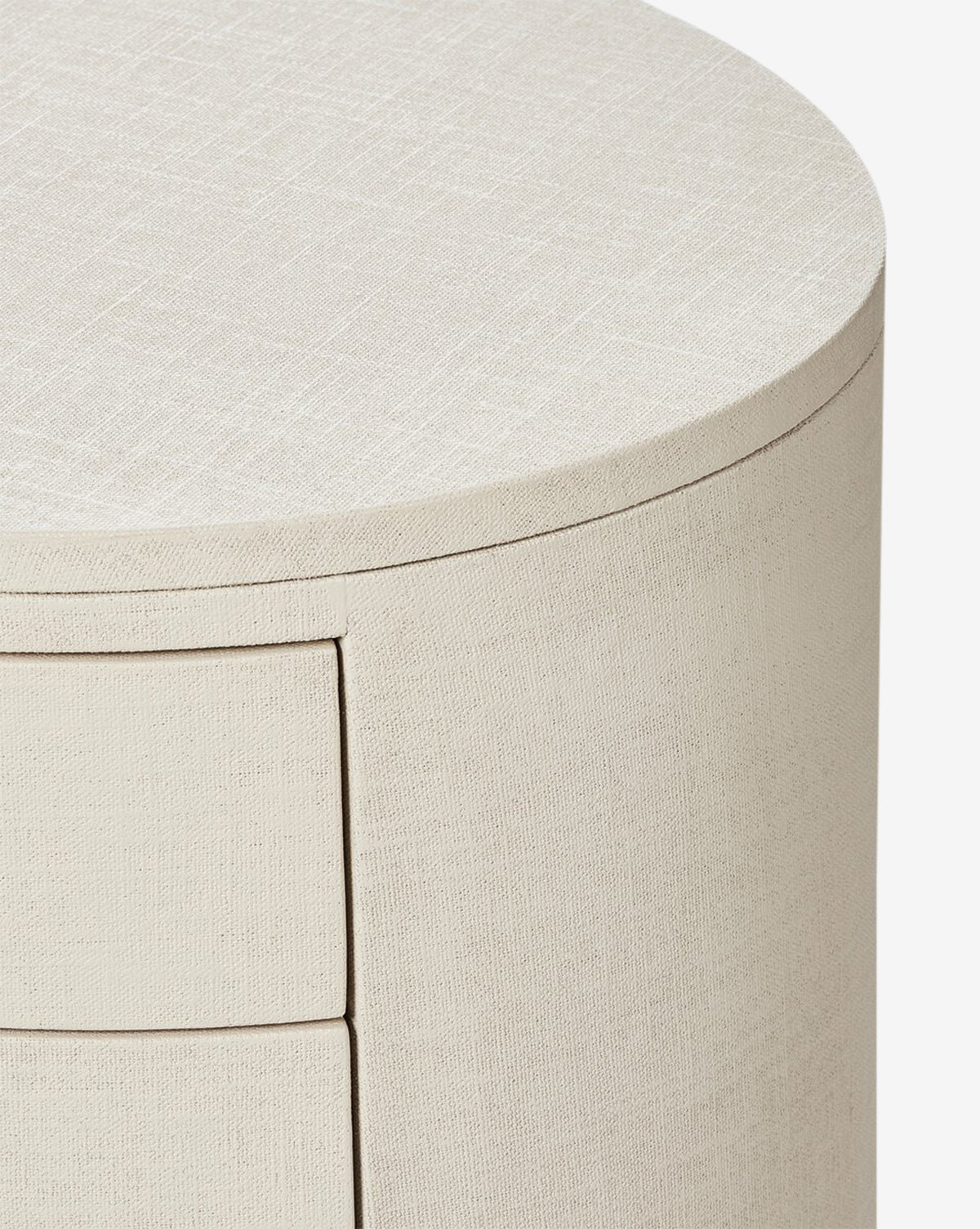 Close-up of the Rosalie Nightstand, featuring a rounded design in ivory-painted linen with a subtle fabric-like finish, highlighting its curved edge and sleek, modern aesthetic by McGee & Co.