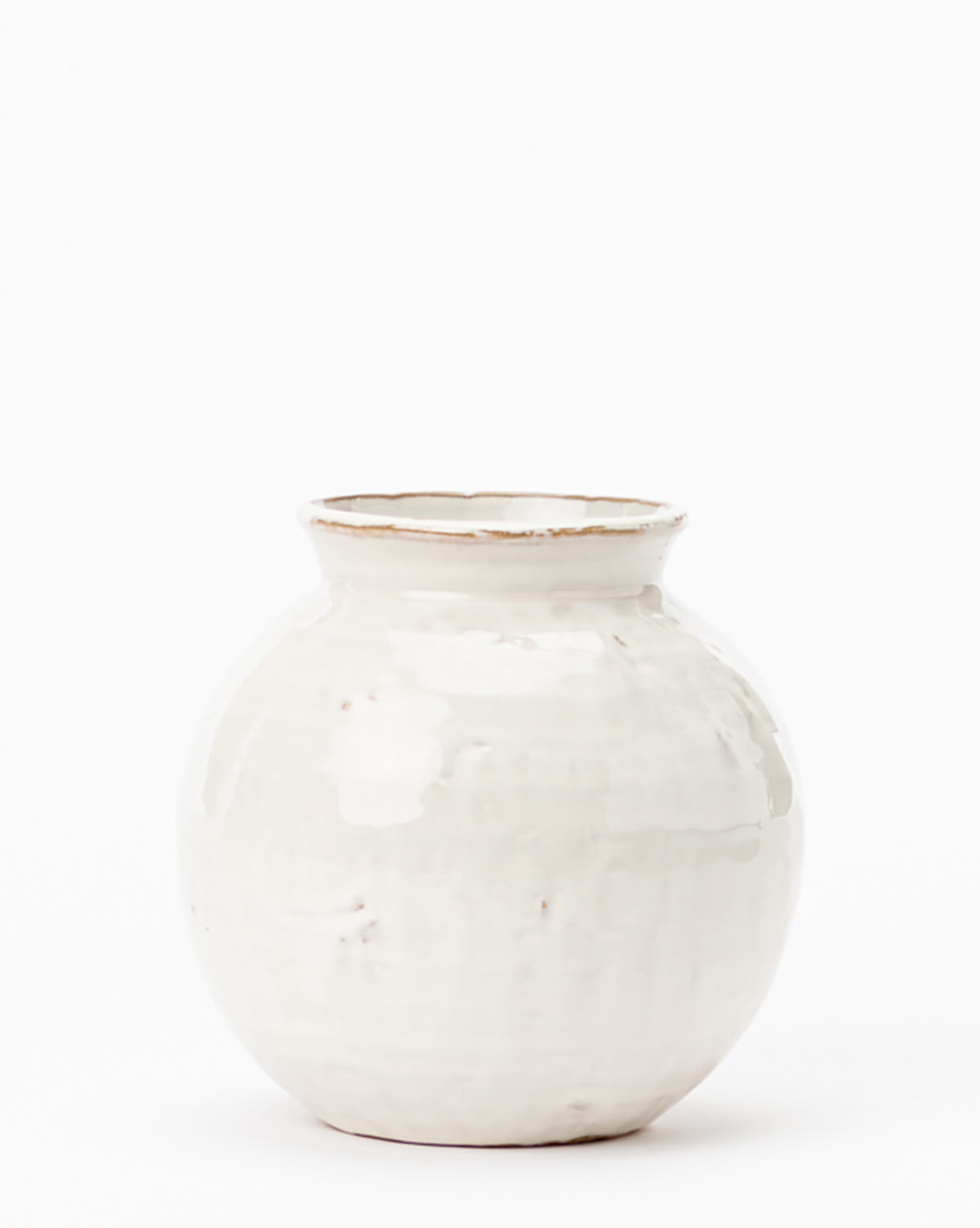 The Rounded Ceramic Vase features a glossy, distressed glaze with brownish accents near its narrow neck and flared rim, set against a plain white background—ideal for modern home decor.