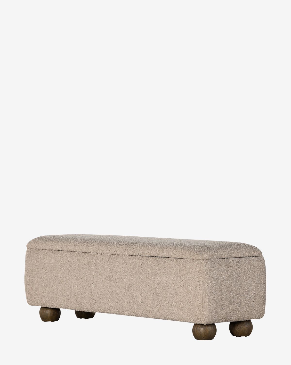 The Rowley Trunk is a rectangular beige ottoman with a modern design, textured performance fabric, and four round, short wooden legs, shown against a plain white background by McGee & Co.