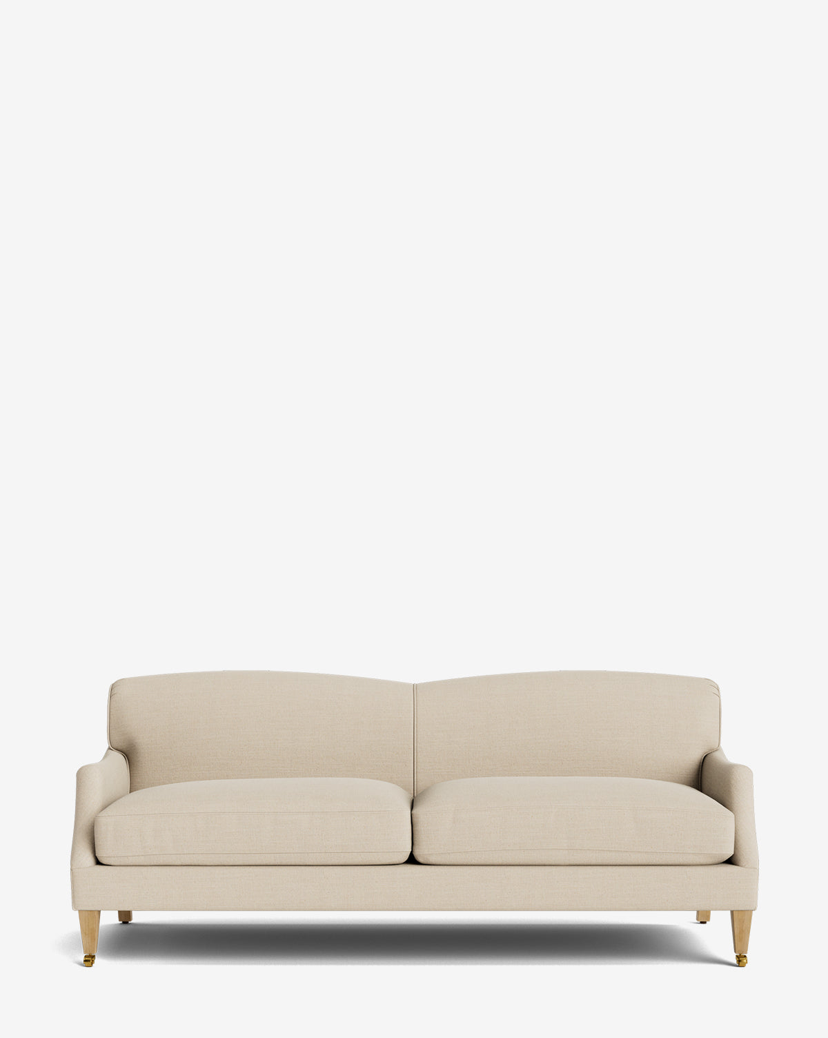 The Rowley Sofa 85 by Rowe Fine Furniture, Inc. is a beige modern three-seater with plush cushions, low arms, and wooden legs with brass caps; it’s hand-crafted and customizable in fabric, shown here on a plain white background. McGee & Co.