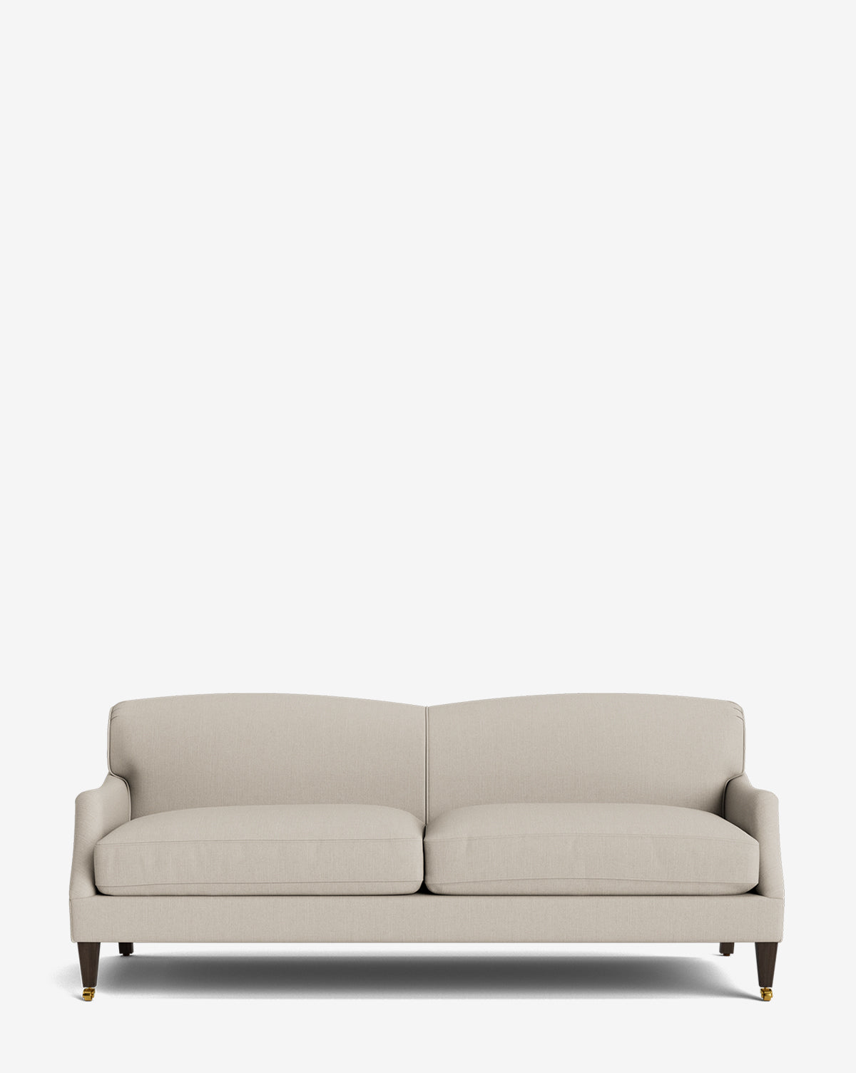 The Rowley Sofa 85 is a modern beige, hand-crafted sofa featuring two seat cushions, low armrests, and wooden legs with brass accents, shown against a plain white background by McGee & Co.
