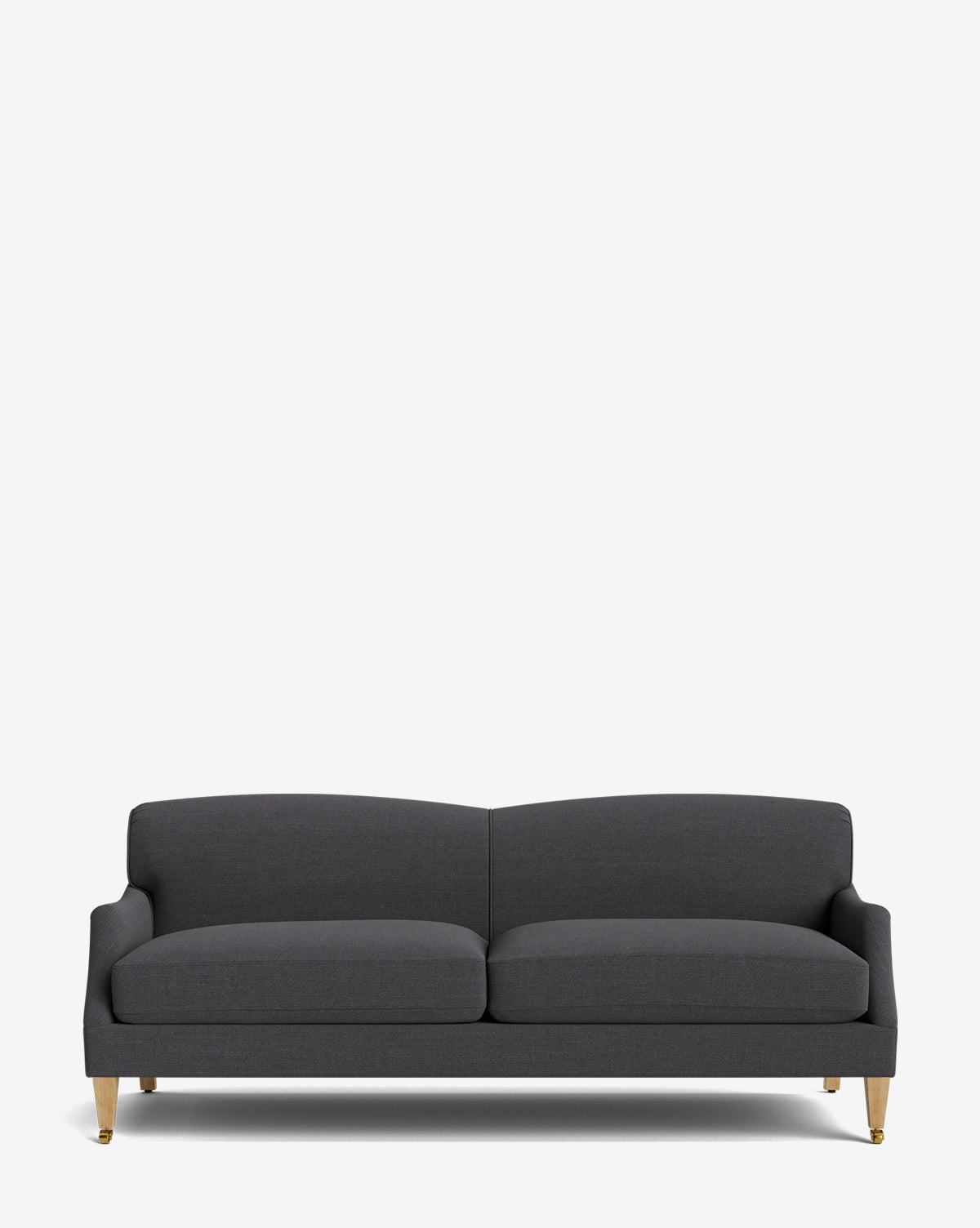 The Rowley Sofa 85 is a modern, dark gray upholstered, hand-crafted sofa featuring two seat cushions, low armrests, and four light wooden legs with gold tips, shown against a plain white background by McGee & Co.