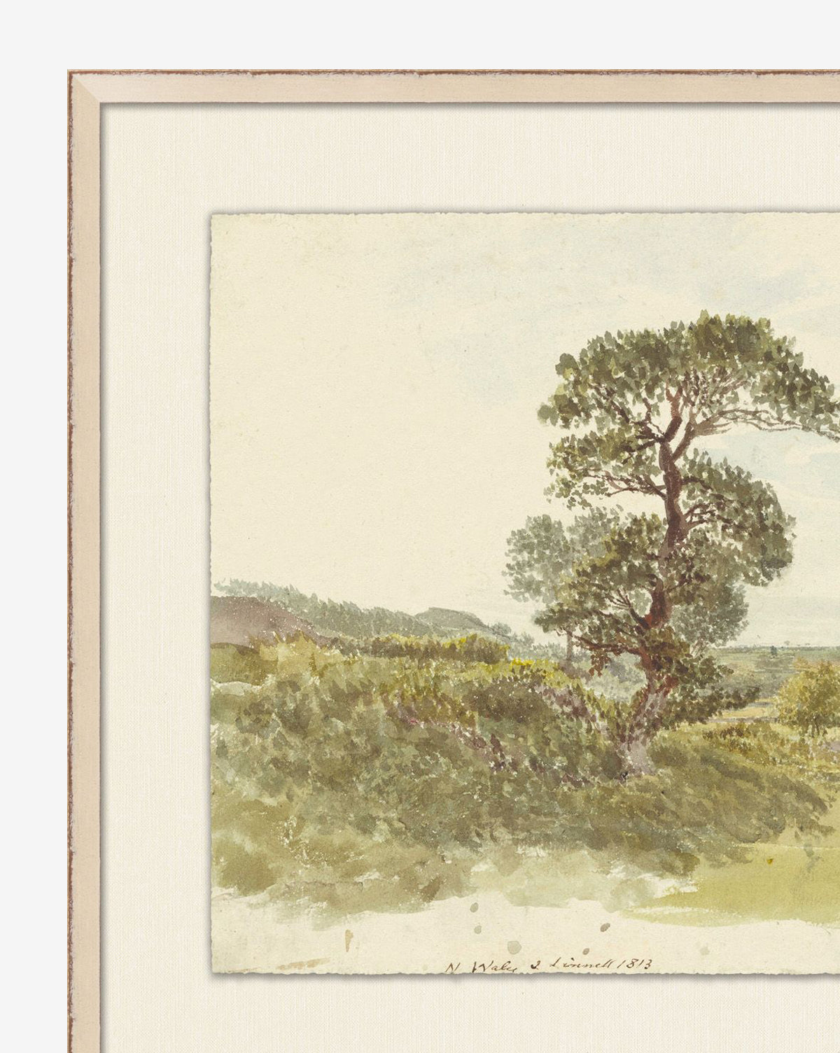Rustic Rhapsody is a framed gallery-quality giclee print featuring a delicate watercolor of a lone tree on a grassy hill, distant hills, and pale sky—evoking tranquility and the beauty of natural landscapes, by McGee & Co.