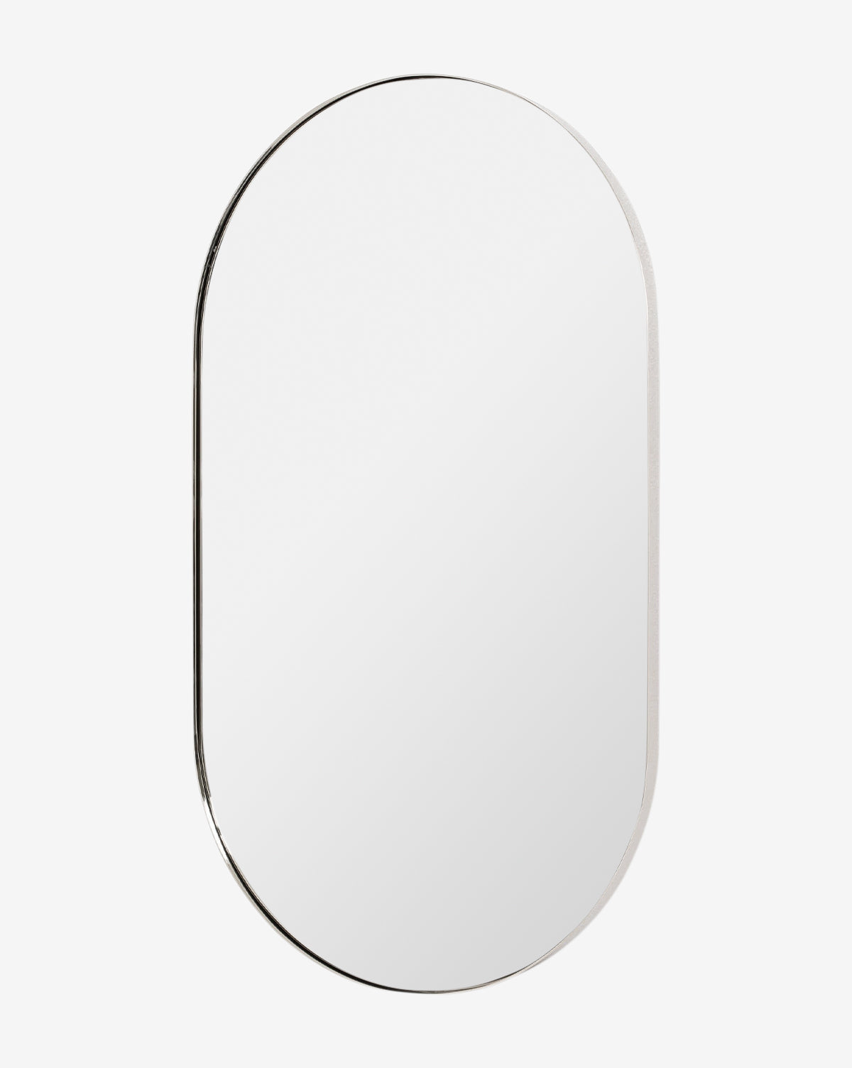 The Rye Wall Mirror features an oval design with a slim stainless steel frame and is shown against a plain white background, by McGee & Co.