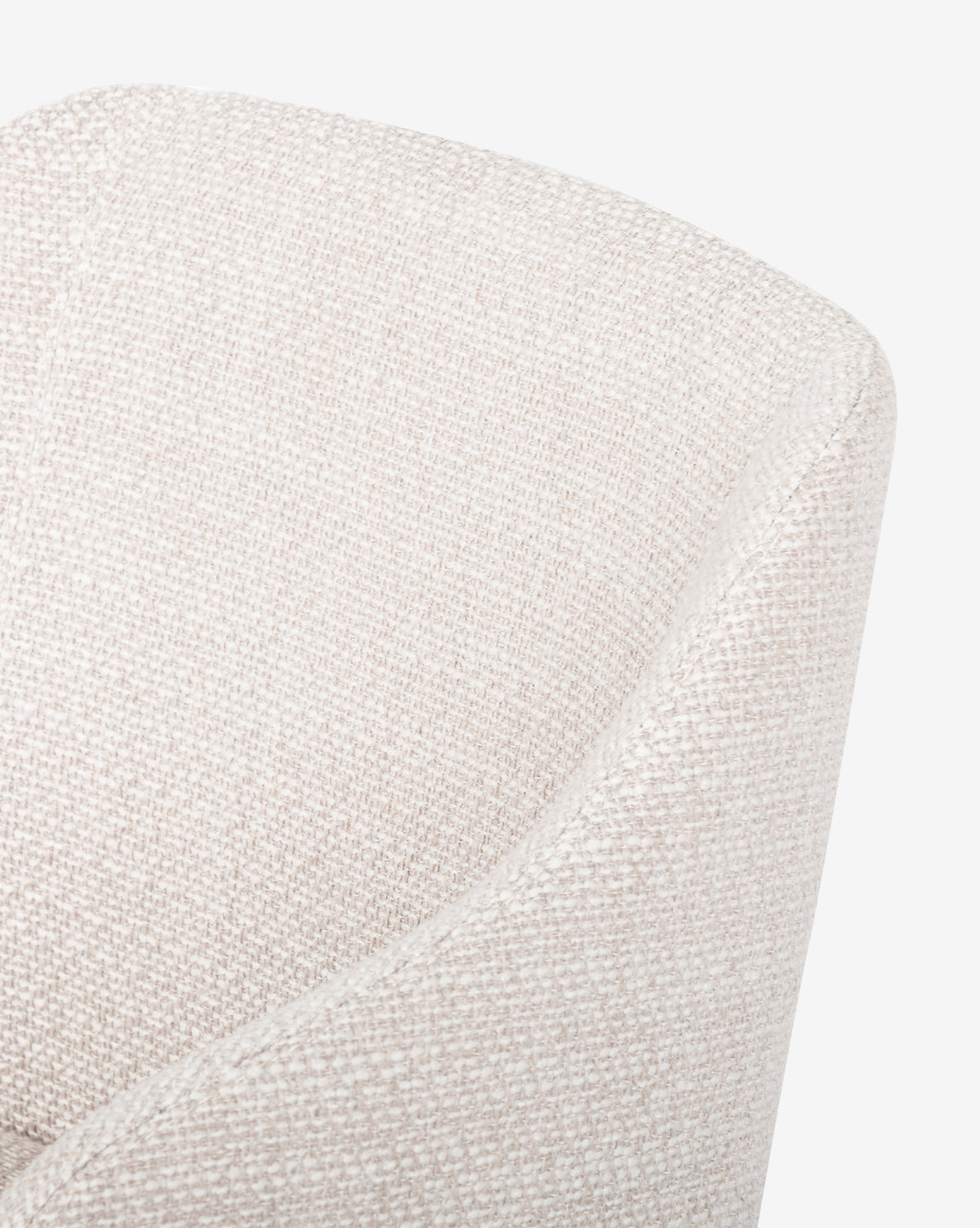 Close-up of the Ryne Dining Chair, featuring modern, curved lines, textured light beige fabric, a soft and comfortable look, and elegant solid oak legs for a stylish touch, by McGee & Co.