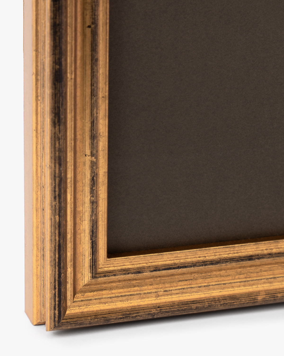 Close-up of the corner of a gold-colored, ornate wooden frame with a dark matte background—ideal for showcasing artwork like Sage Shores I.