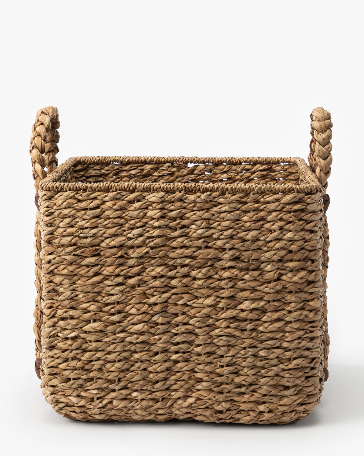 The Salter Woven Square Basket features a rectangular seagrass design with two thick, braided side handles, displayed against a plain white background, by McGee & Co.