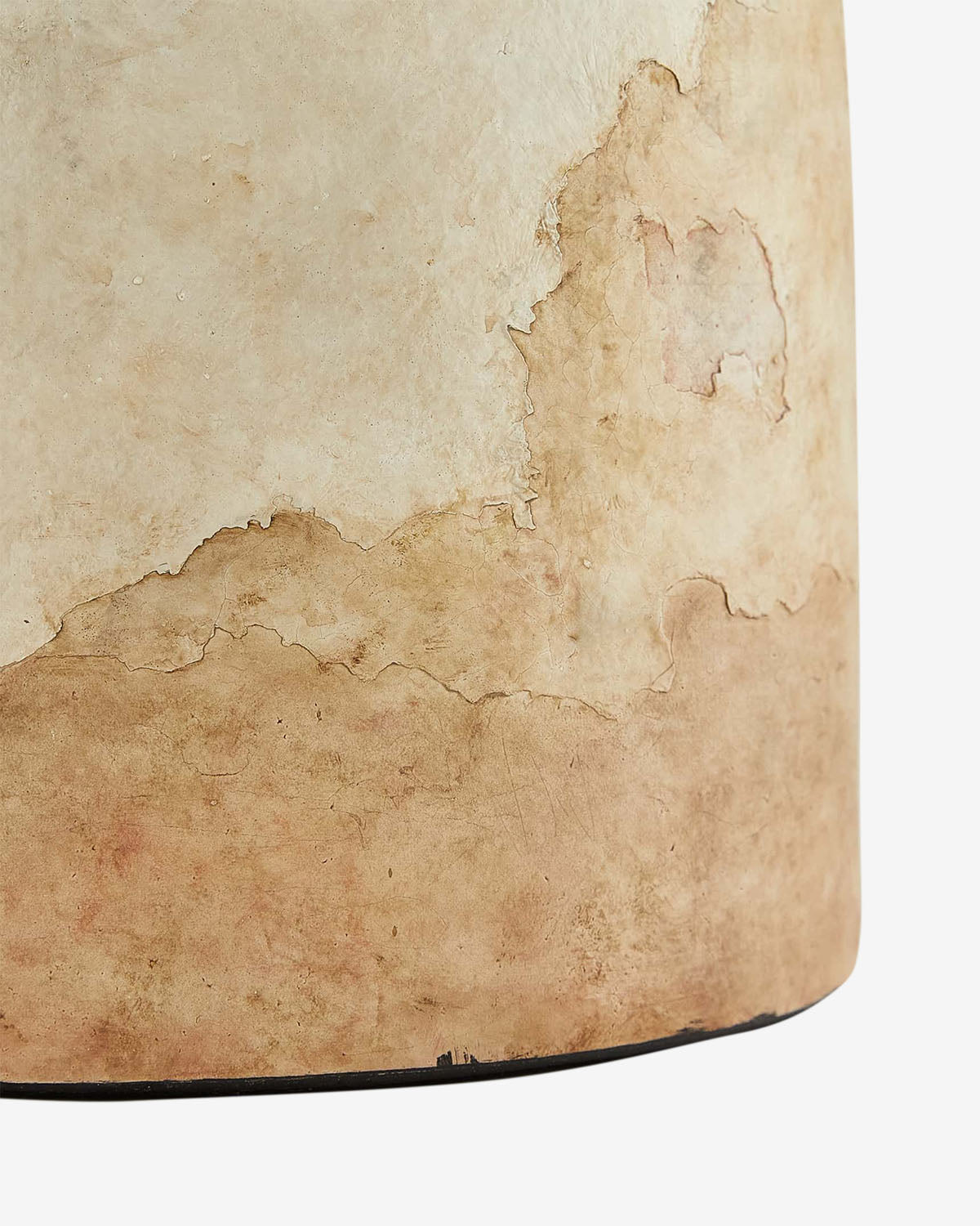 A close-up of a rustic, textured surface with peeling beige and tan paint—perfect for complementing vintage decor such as the timeless Samala Lamp for added charm, by McGee & Co.