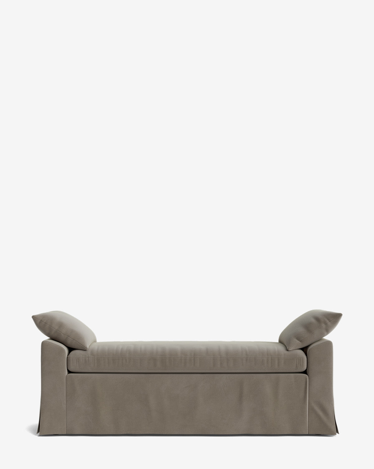 The Scaletta Bench is a modern, taupe-upholstered bench with two angled pillows at each end, a minimalist design, and a floor-length fabric skirt. Crafted in performance fabric, it’s shown against a plain white background by McGee & Co.
